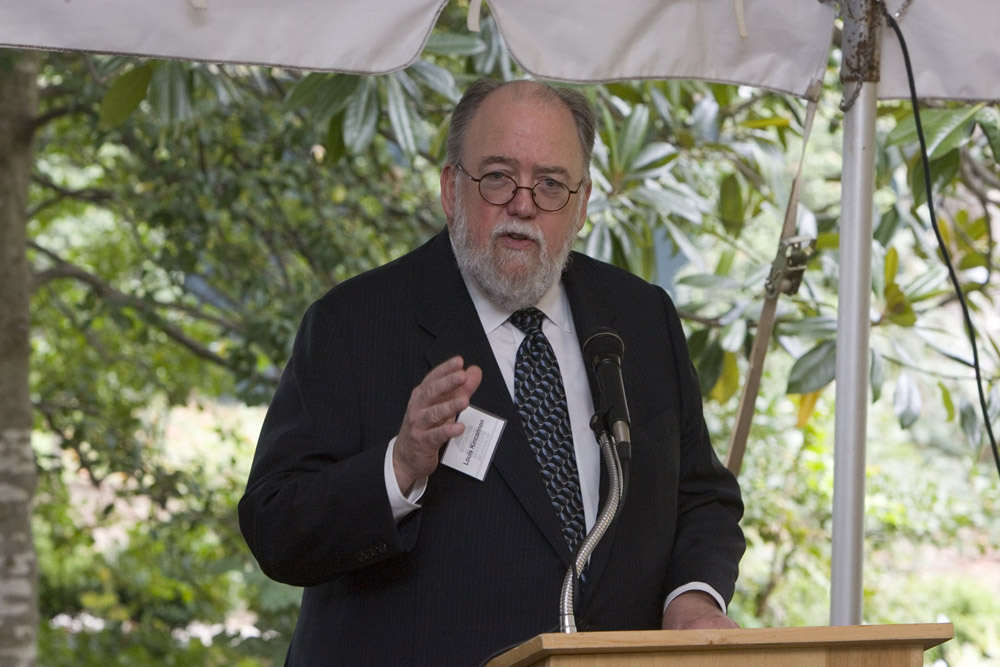 Charles L. Kincannon speaking to a crowd from a podium