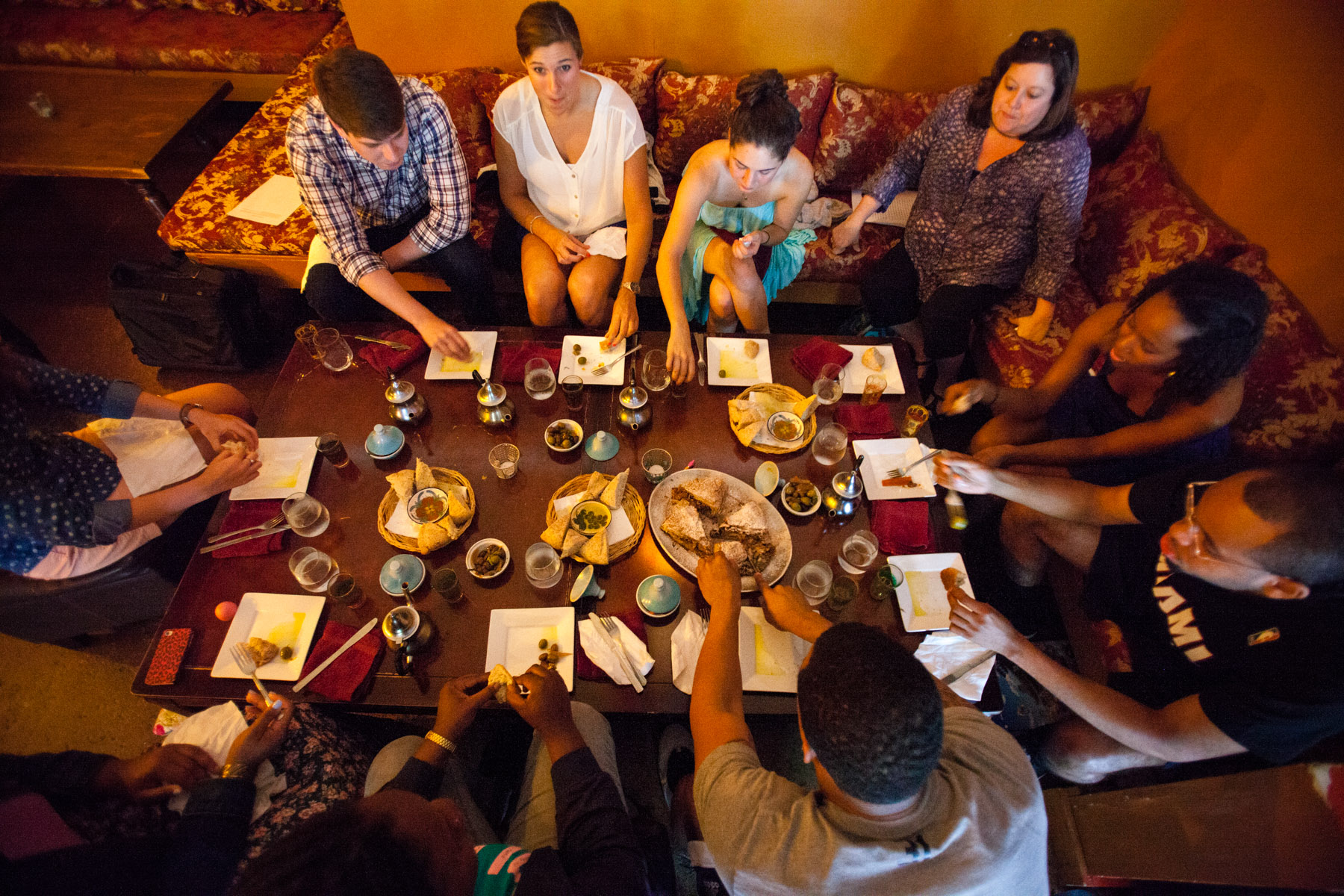 Group of students sit at a table eating