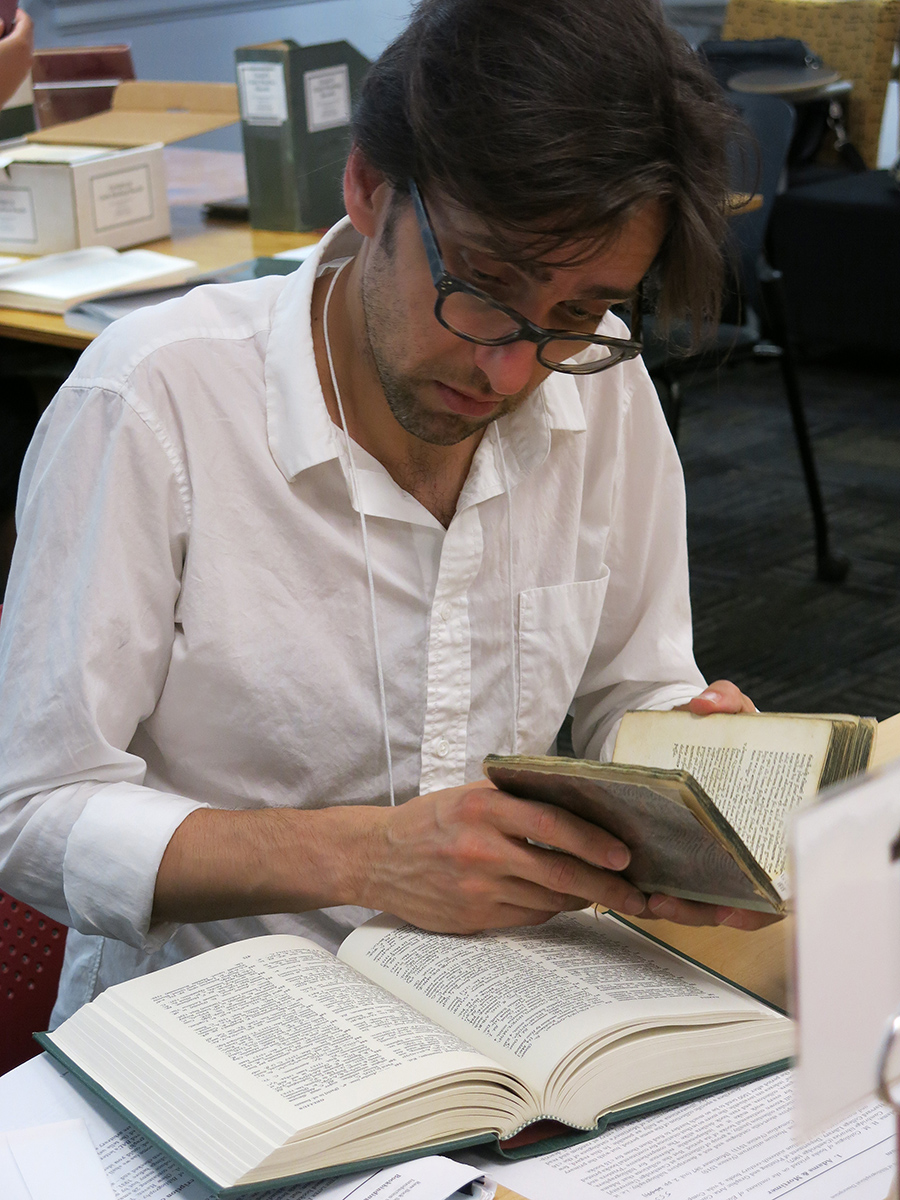 András Kiséry reading a book