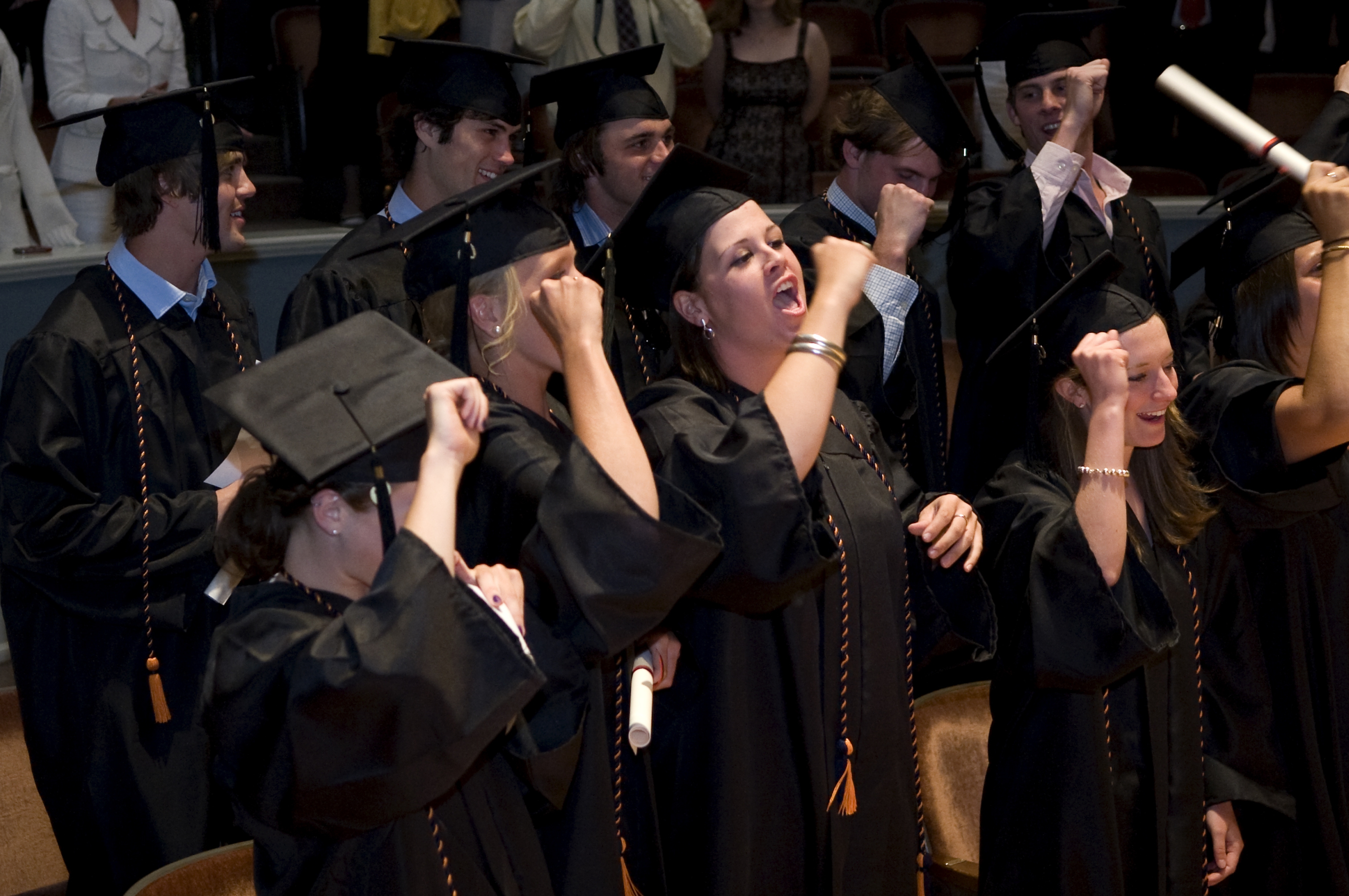 Graduates singing and cheering