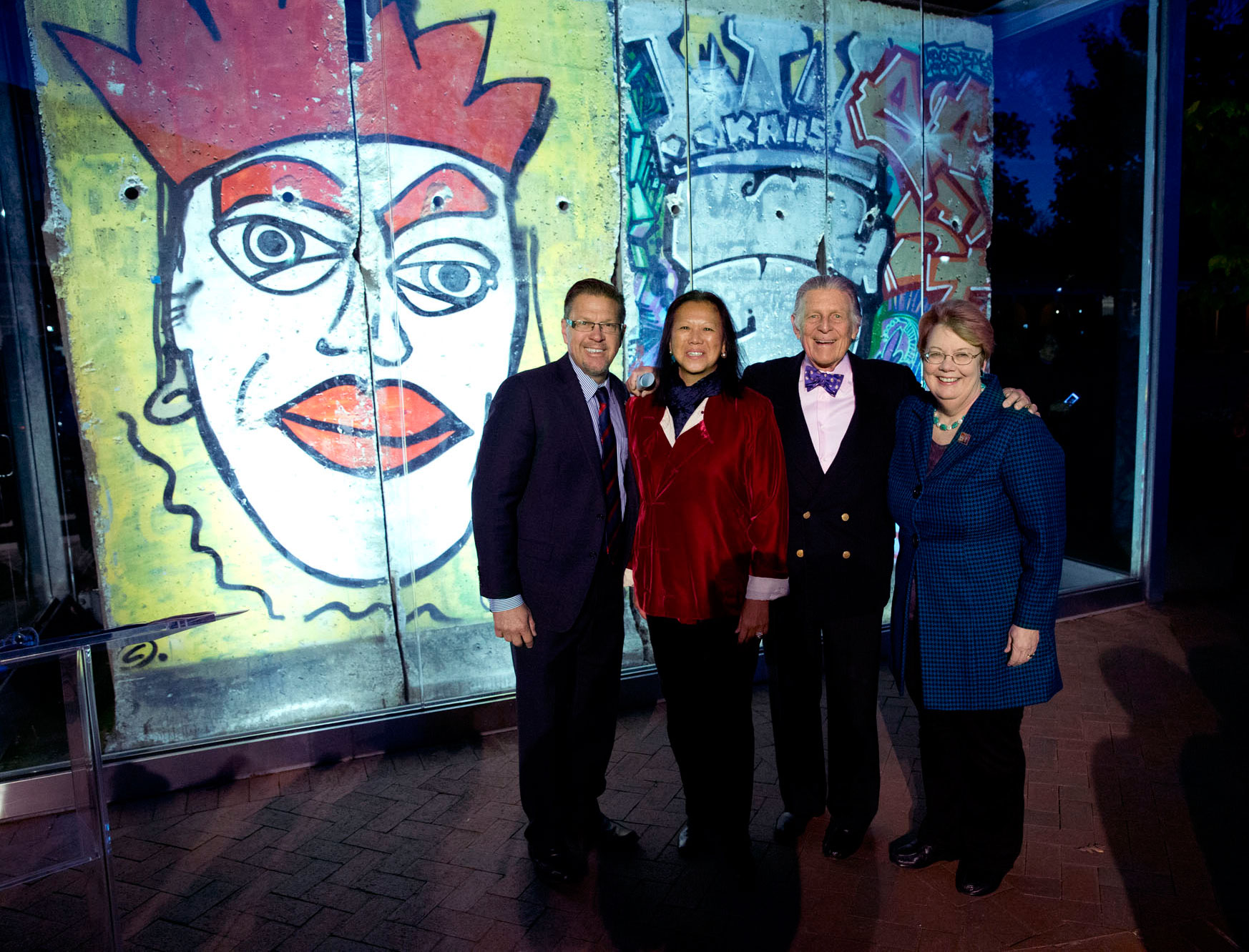 Group photo left to right: Robert Hefner, MeiLi Hefner., Jody Kielbasa, and President Teresa A. Sullivan 