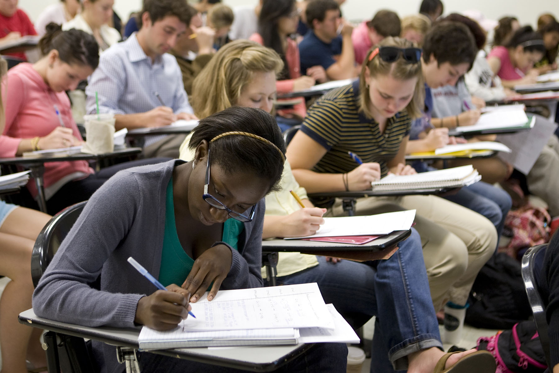 Students working in desks in a classroom