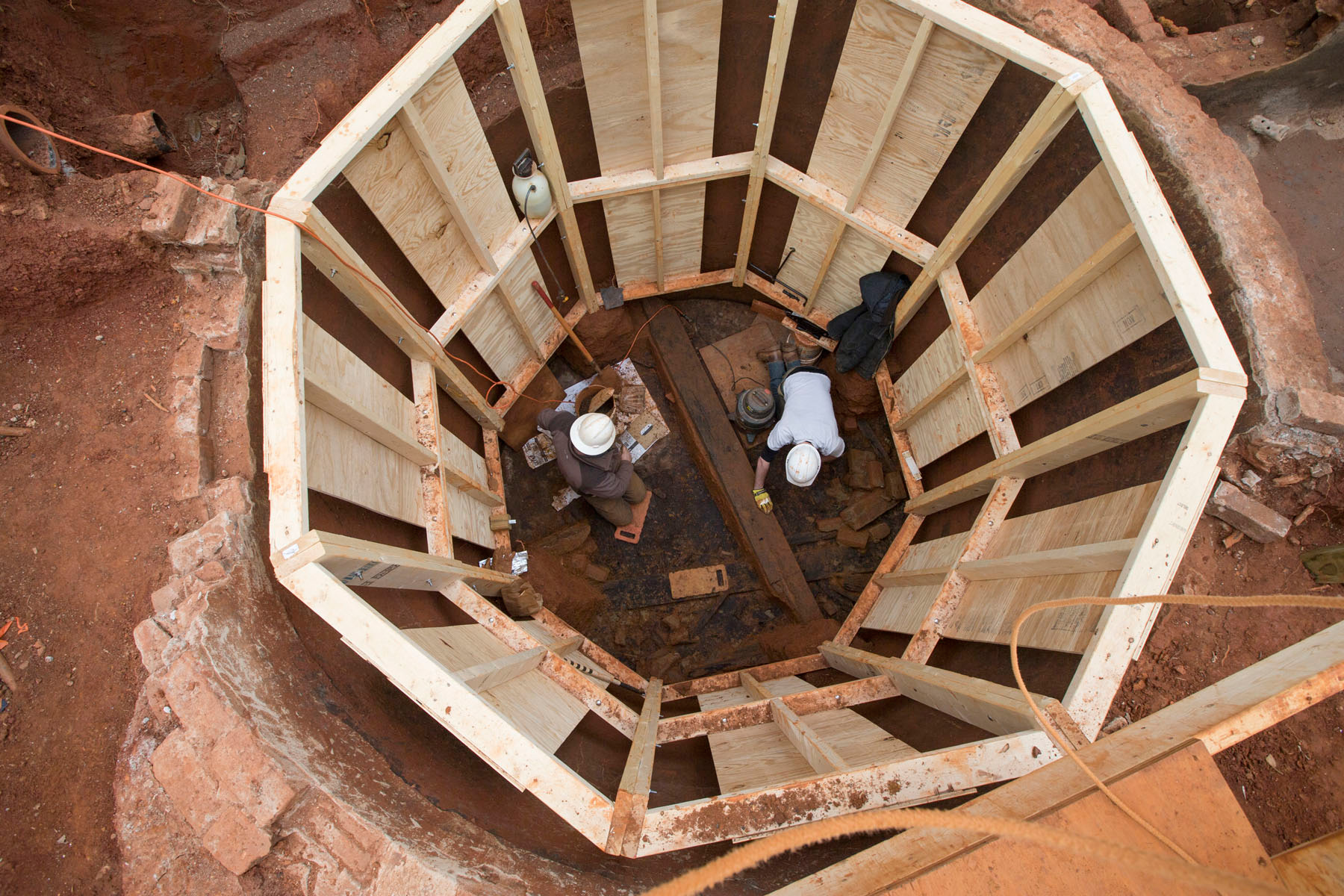 Steve Thompson (left) and Travis Maslen work in a cistern