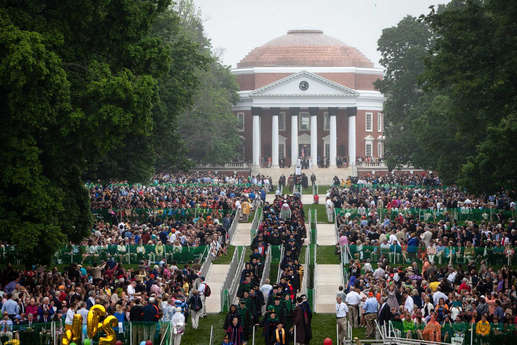 Aerial view of Graduates walking across the lawn from the Rotunda to their seats