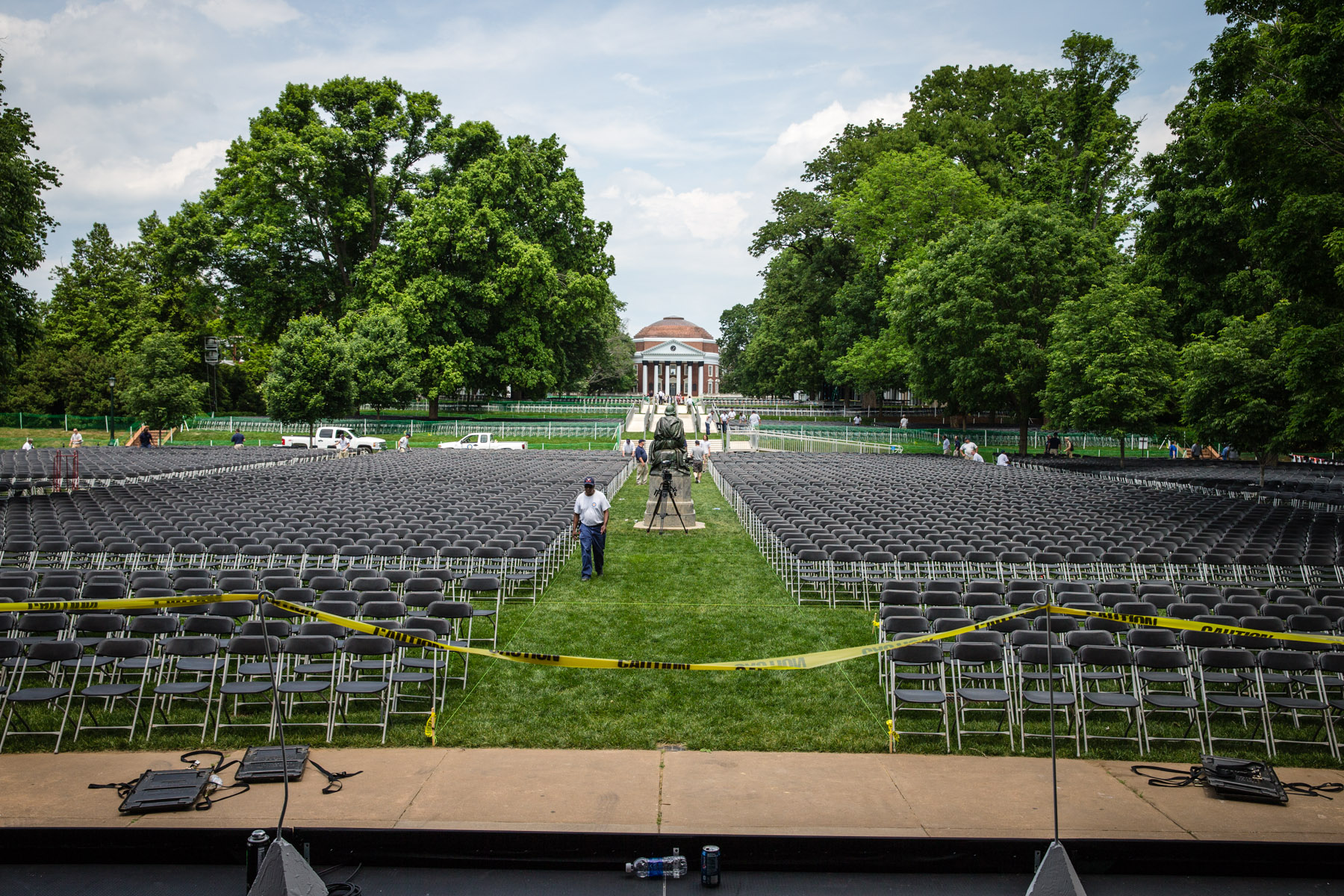 UVA Workers setting chairs on the lawn for Final Exercises