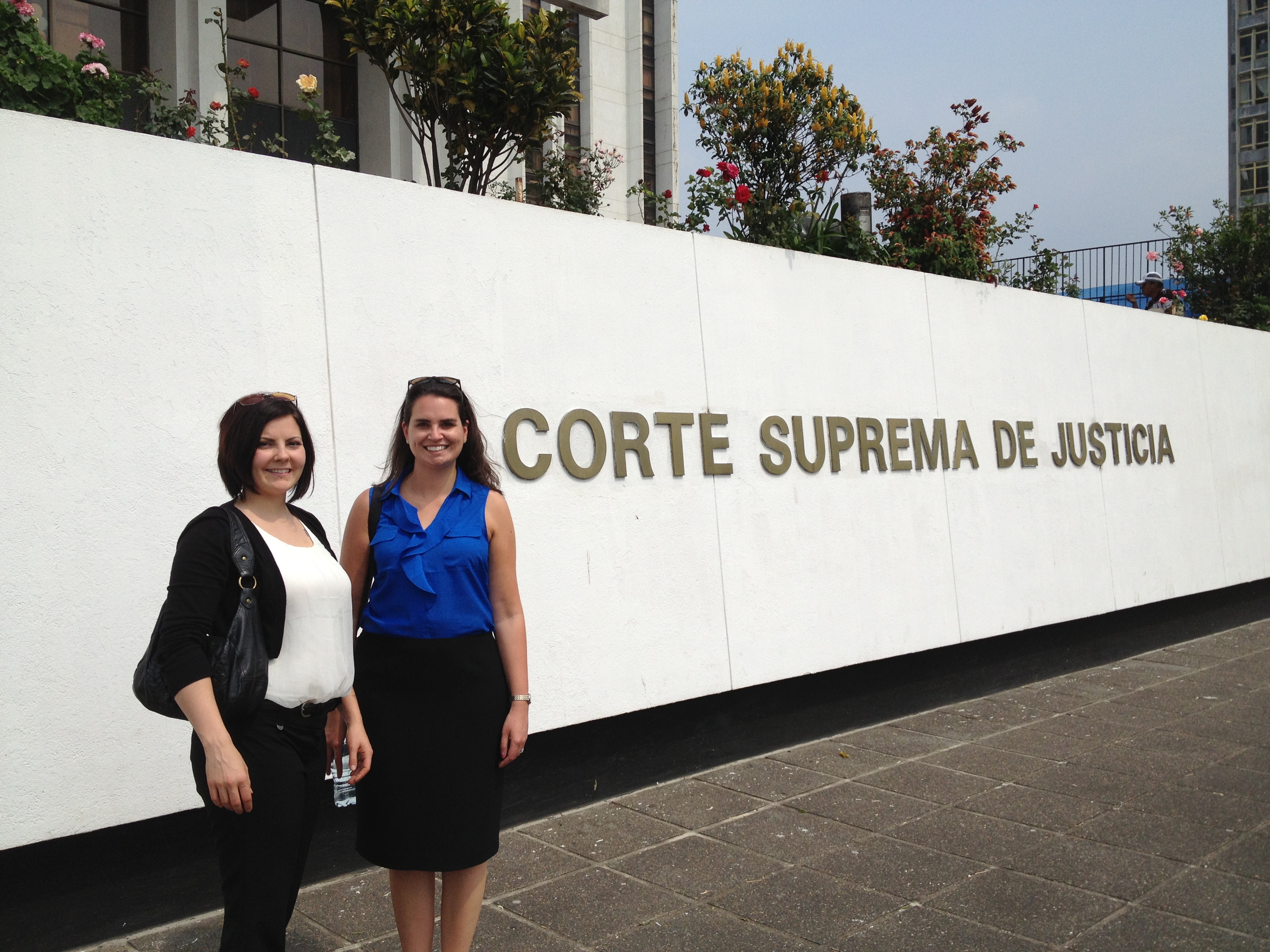 Mariah Thompson (left) and Kendra Wergin in front of a Guatemalan court house