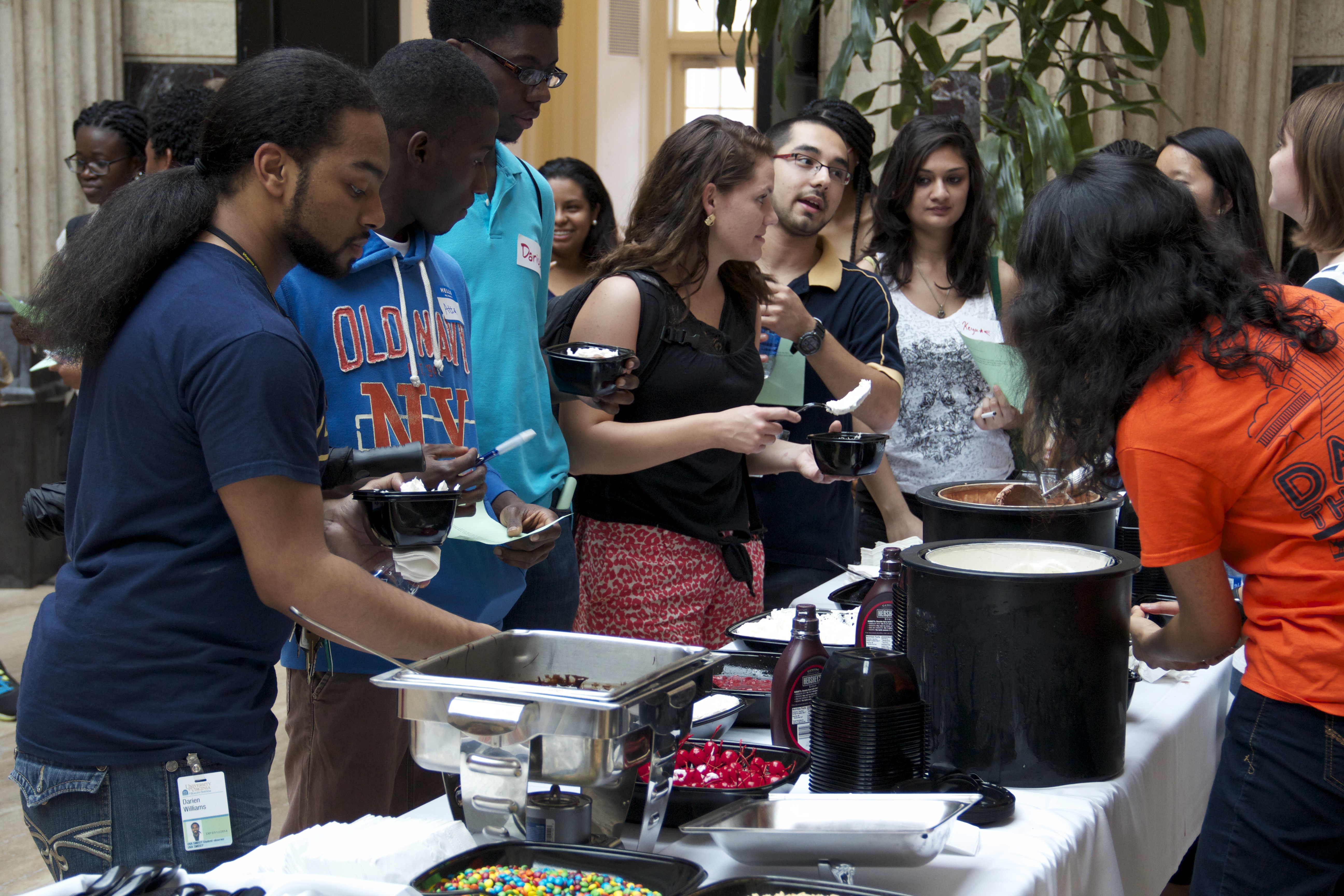 Students serving other students ice cream at an ice cream social