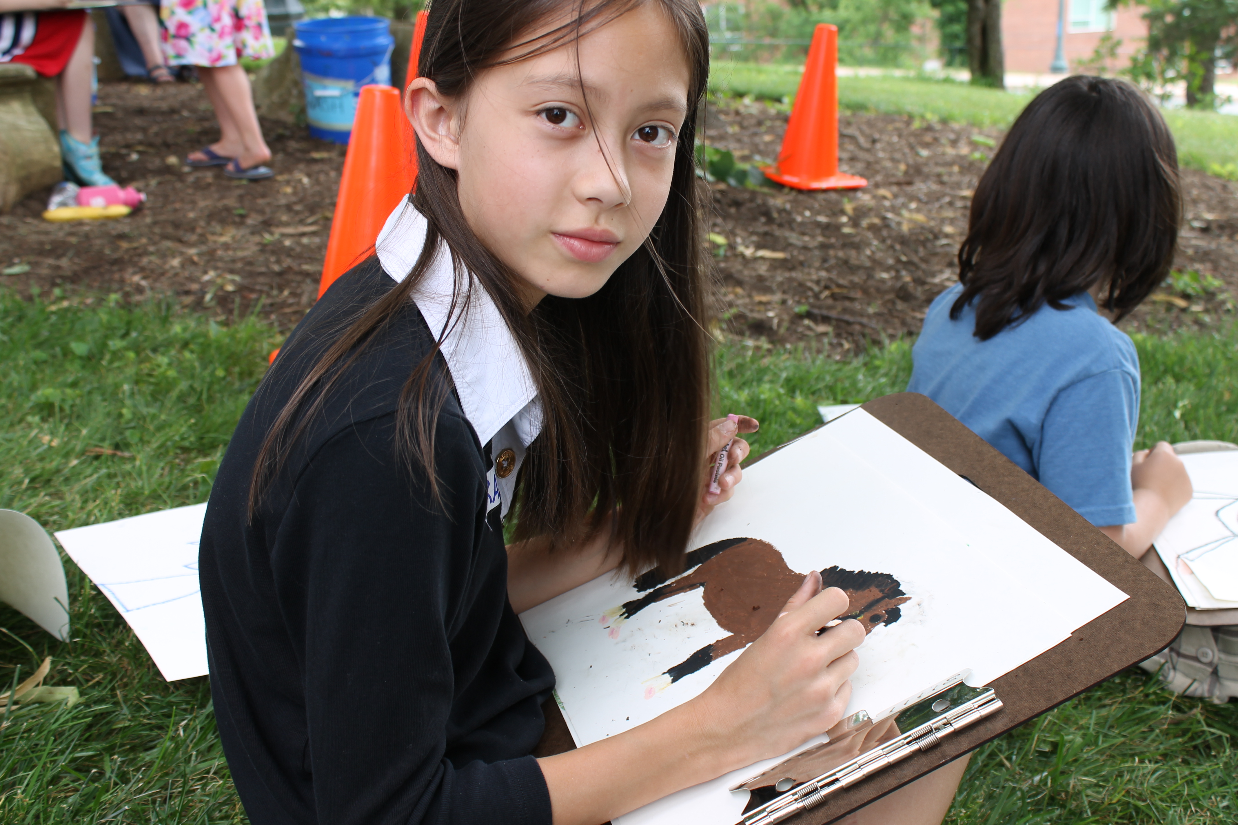 Young student painting a horse