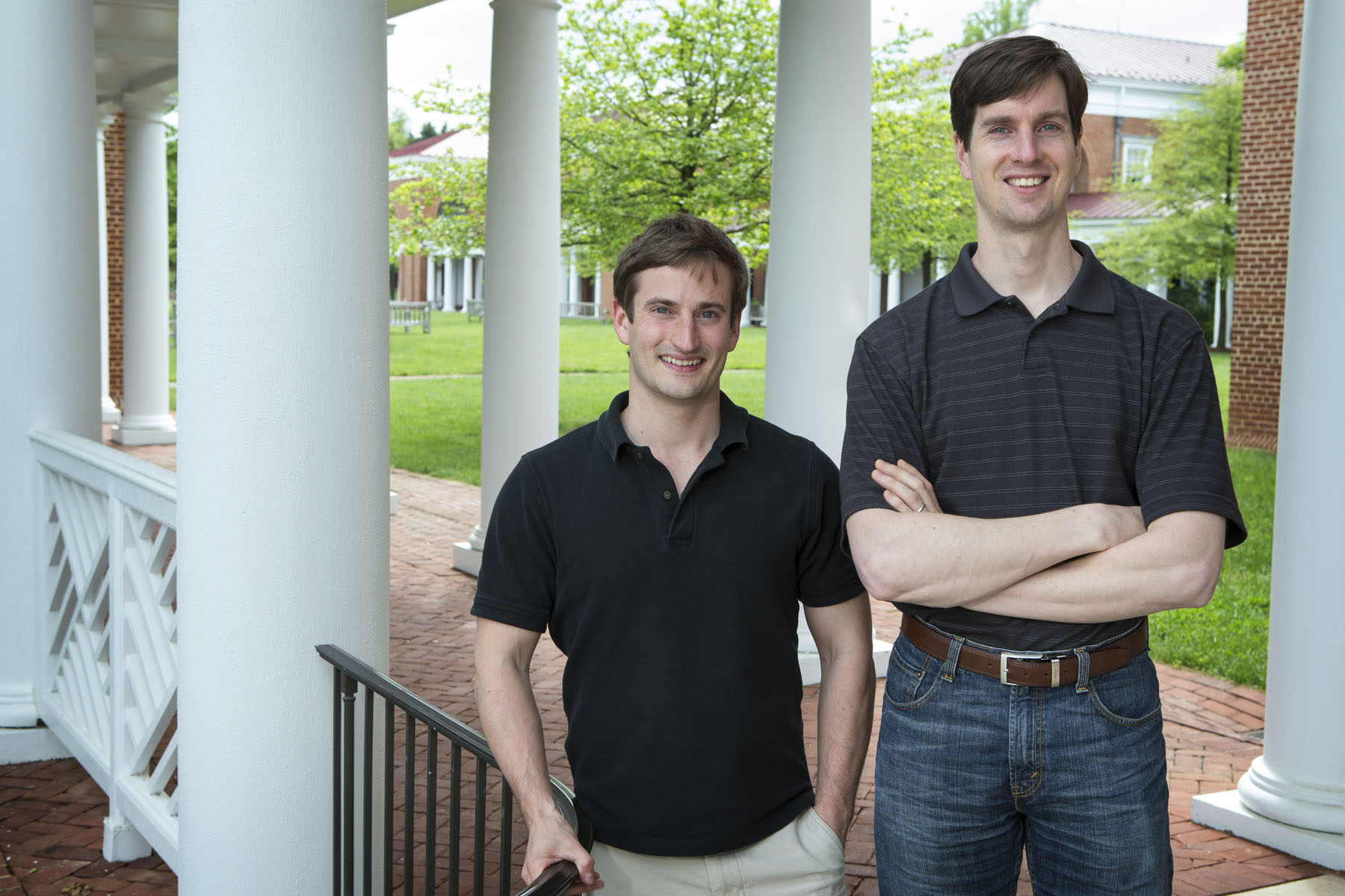 Kyle Redinger and Baron Schwartz stand together smiling