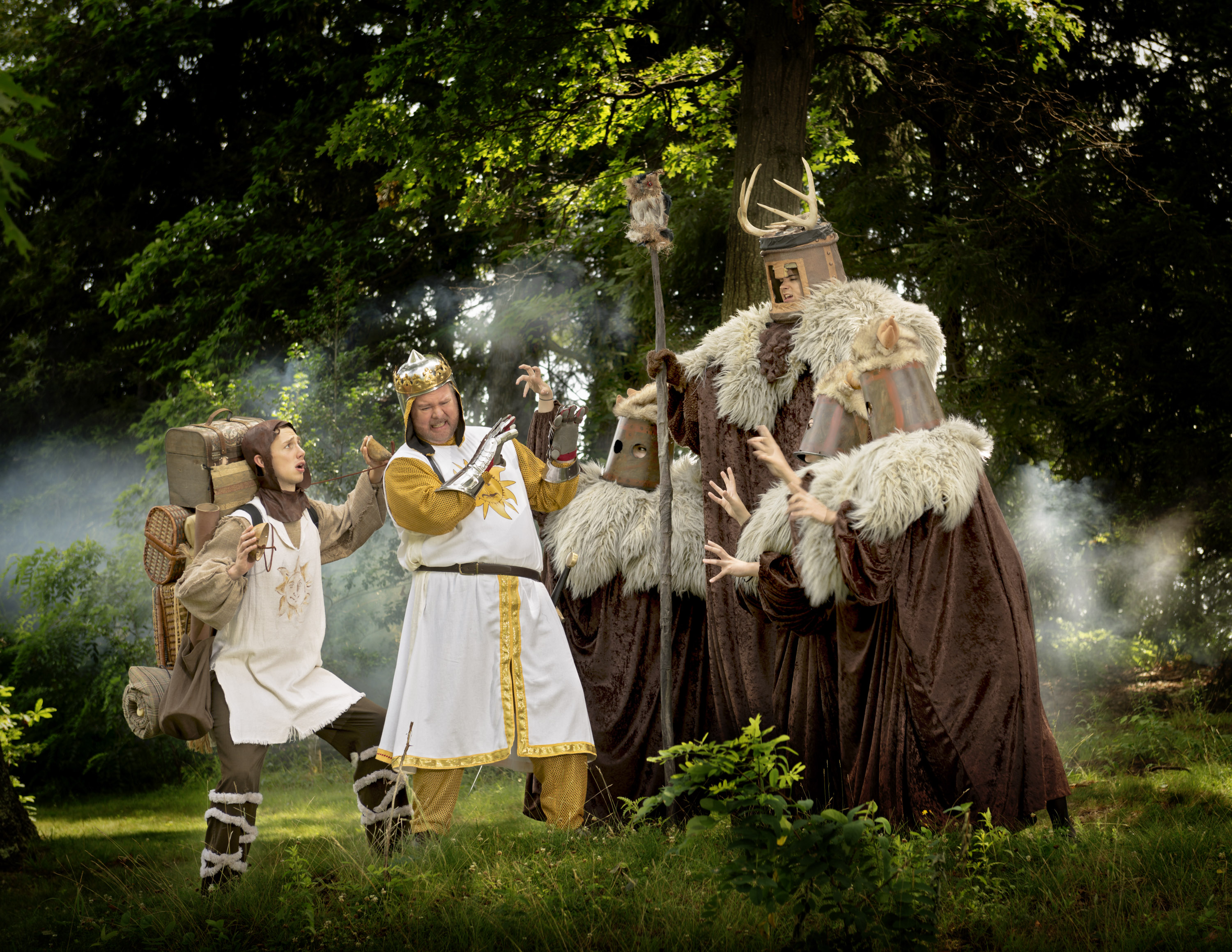 Patsy (Patrick Rosé, left) and King Arthur (Gregg Lloyd, right) meet knights on a path on stage