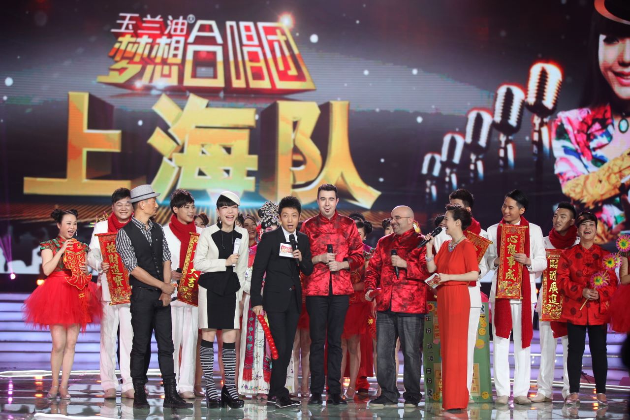 Habib and Nierow, on China's Clash of the Choirs, stand in Red Satin shirts in the middle