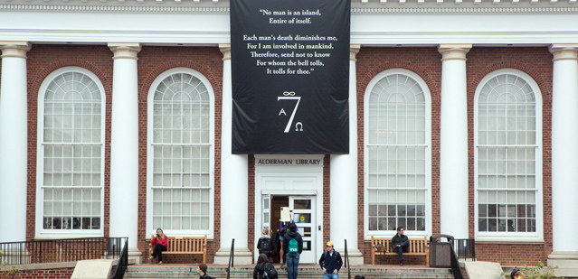 The Seven Society hung a banner over top of the Alderman Library Entrance