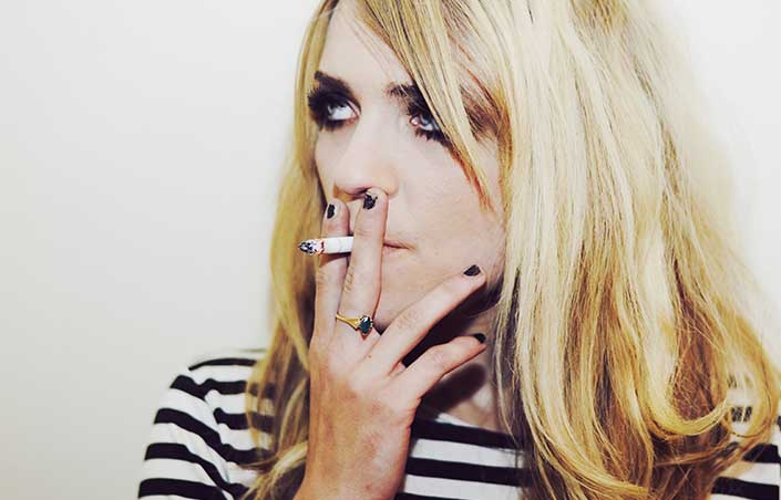 Kelsey smoking a cigarette 