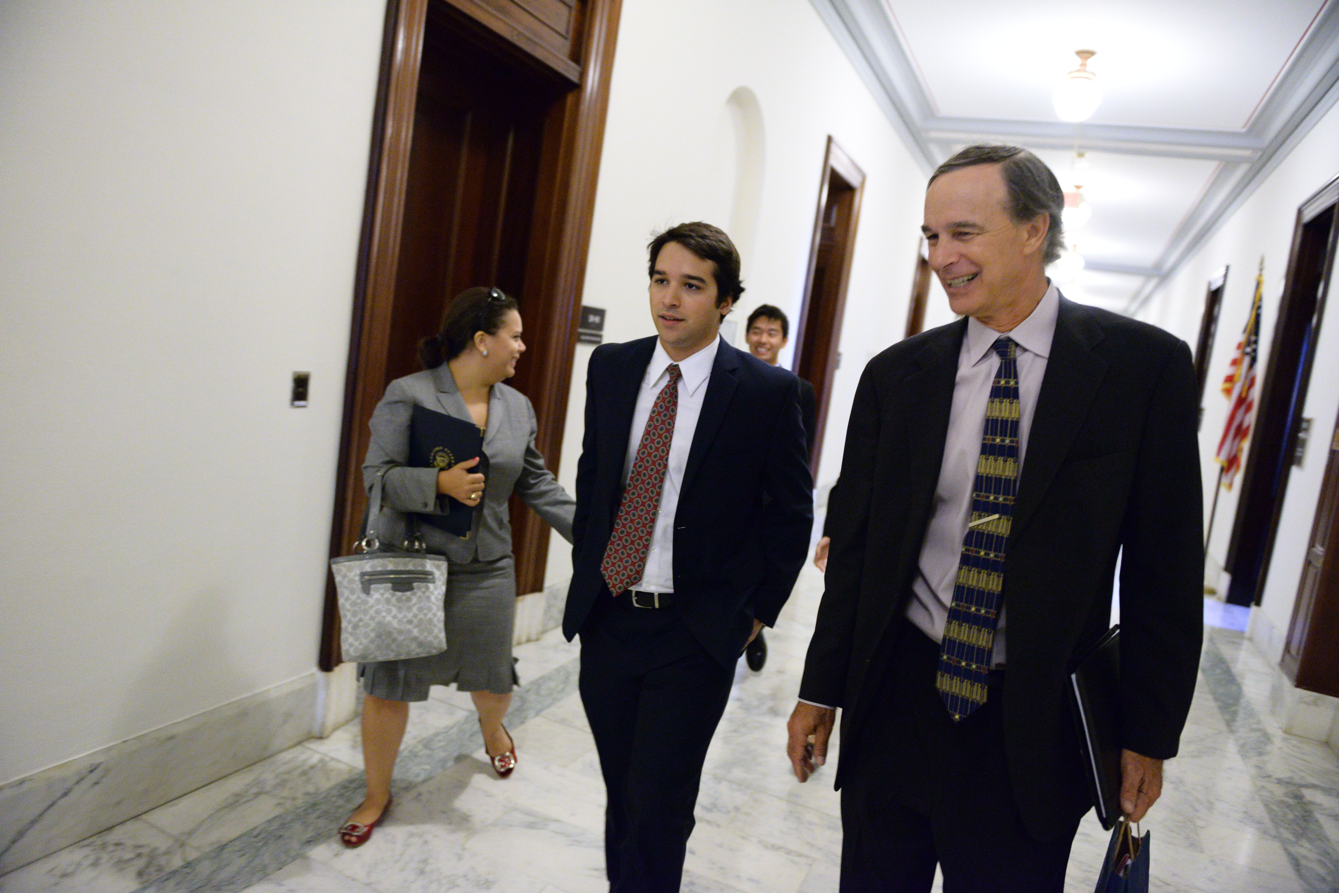  Gerry Warburg, right, walking the Russell Senate building with three UVA students