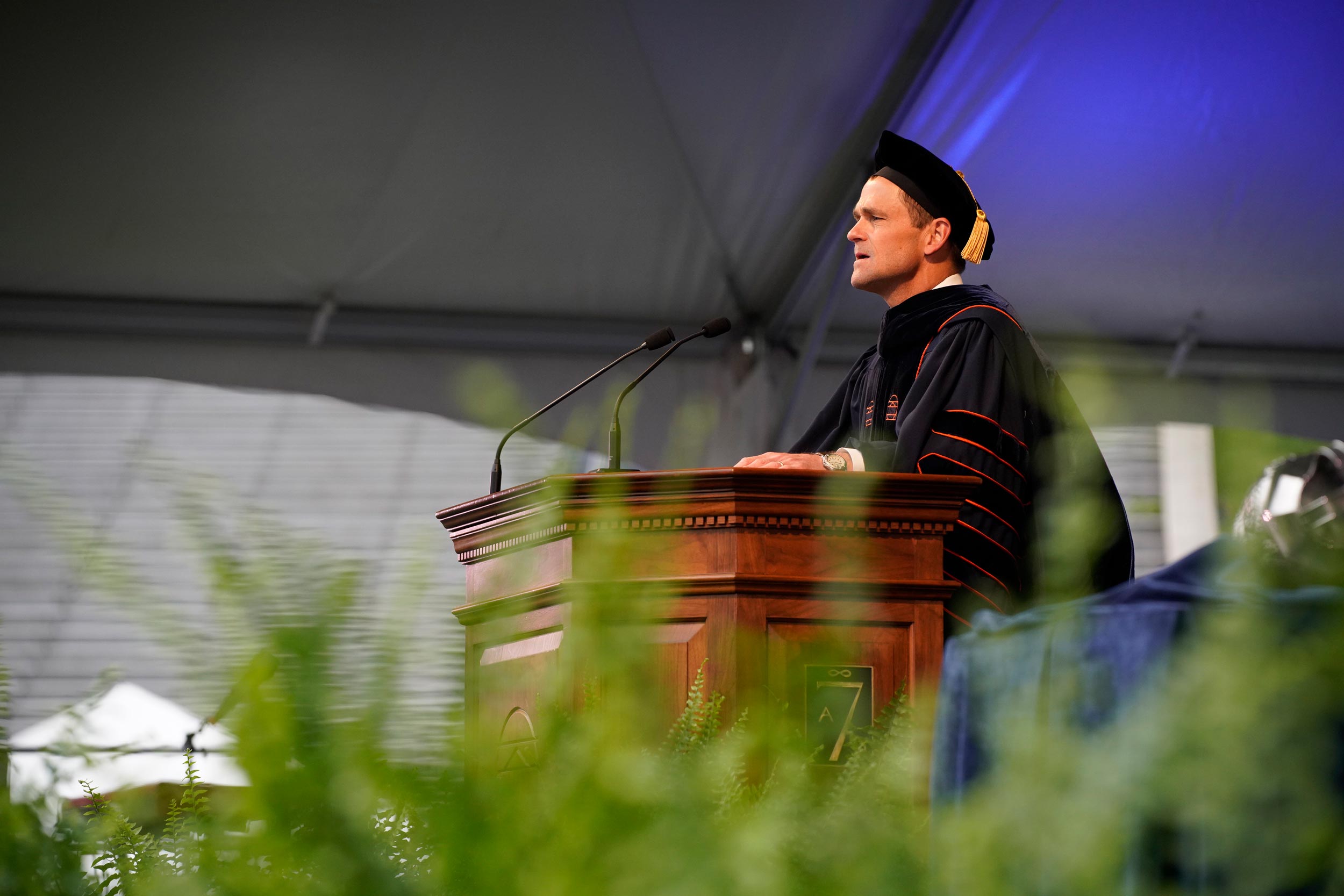 President Ryan standing at a podium giving a speech at Final Exercises