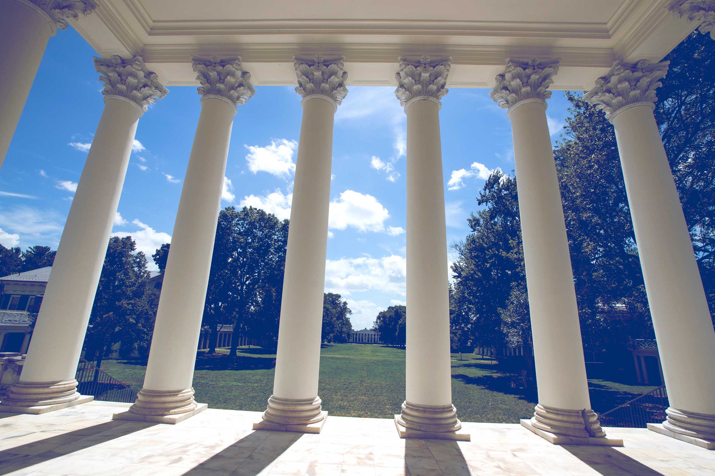 The six columns of the Rotunda with the Lawn and Old Cabell hall behind