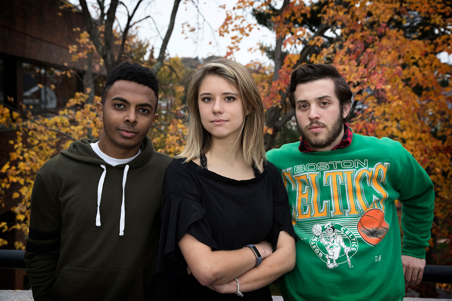 From left, Alazar Aklilu, Emily Dhue and Joshua Palmer stand together looking at the camera