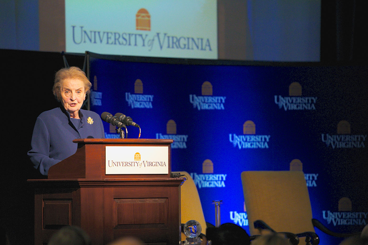 Albright speaking to a crowd from a podium