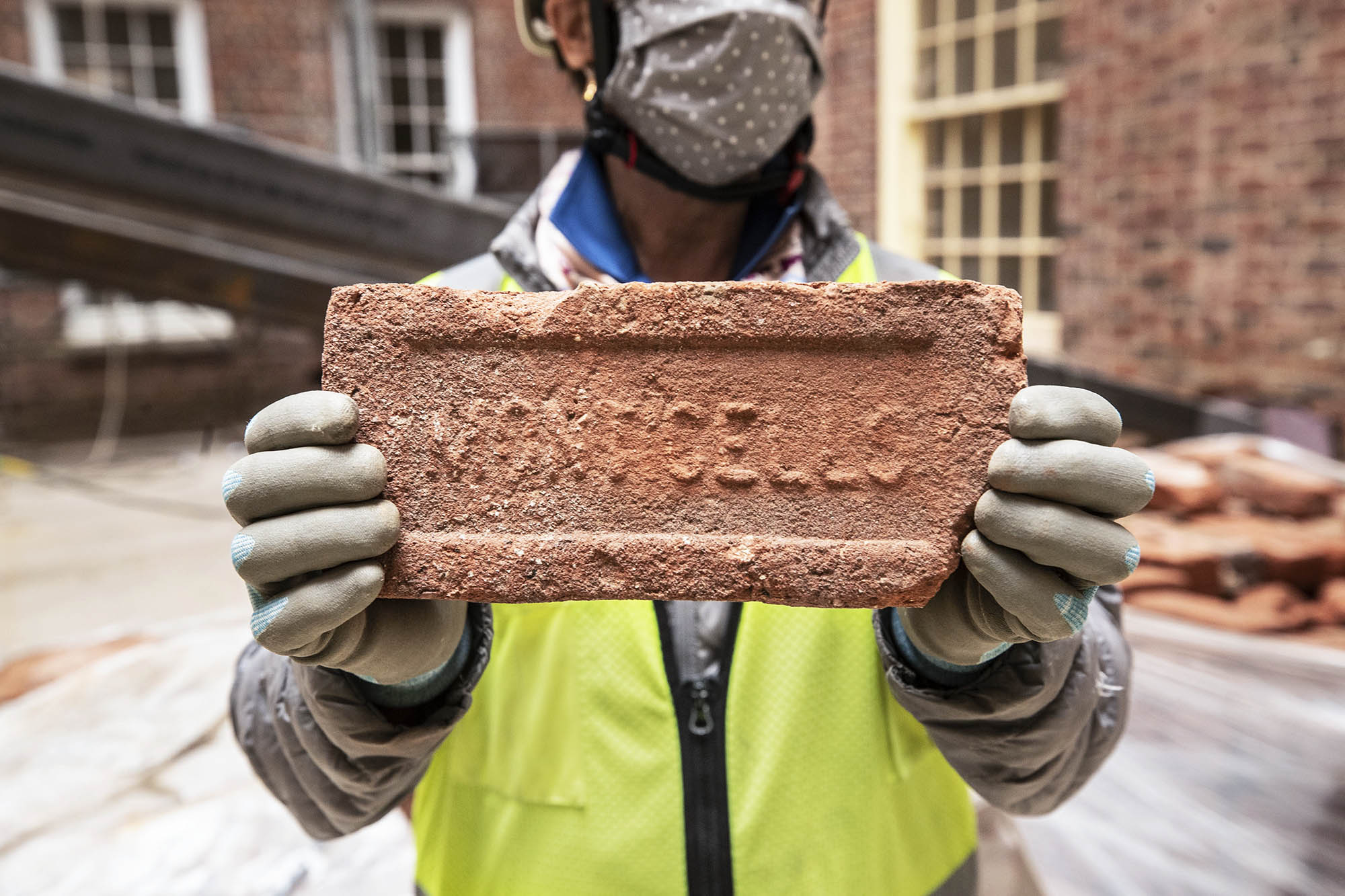  Kit Meyer holds a Monticello brick