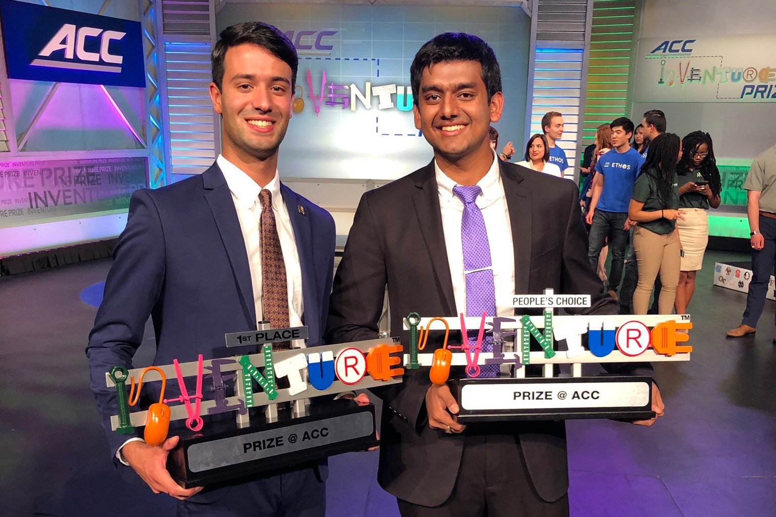 Alexander Singh and Rohit Rustagi at ACC InVenture competition holding their awards, 1st place and people's choice