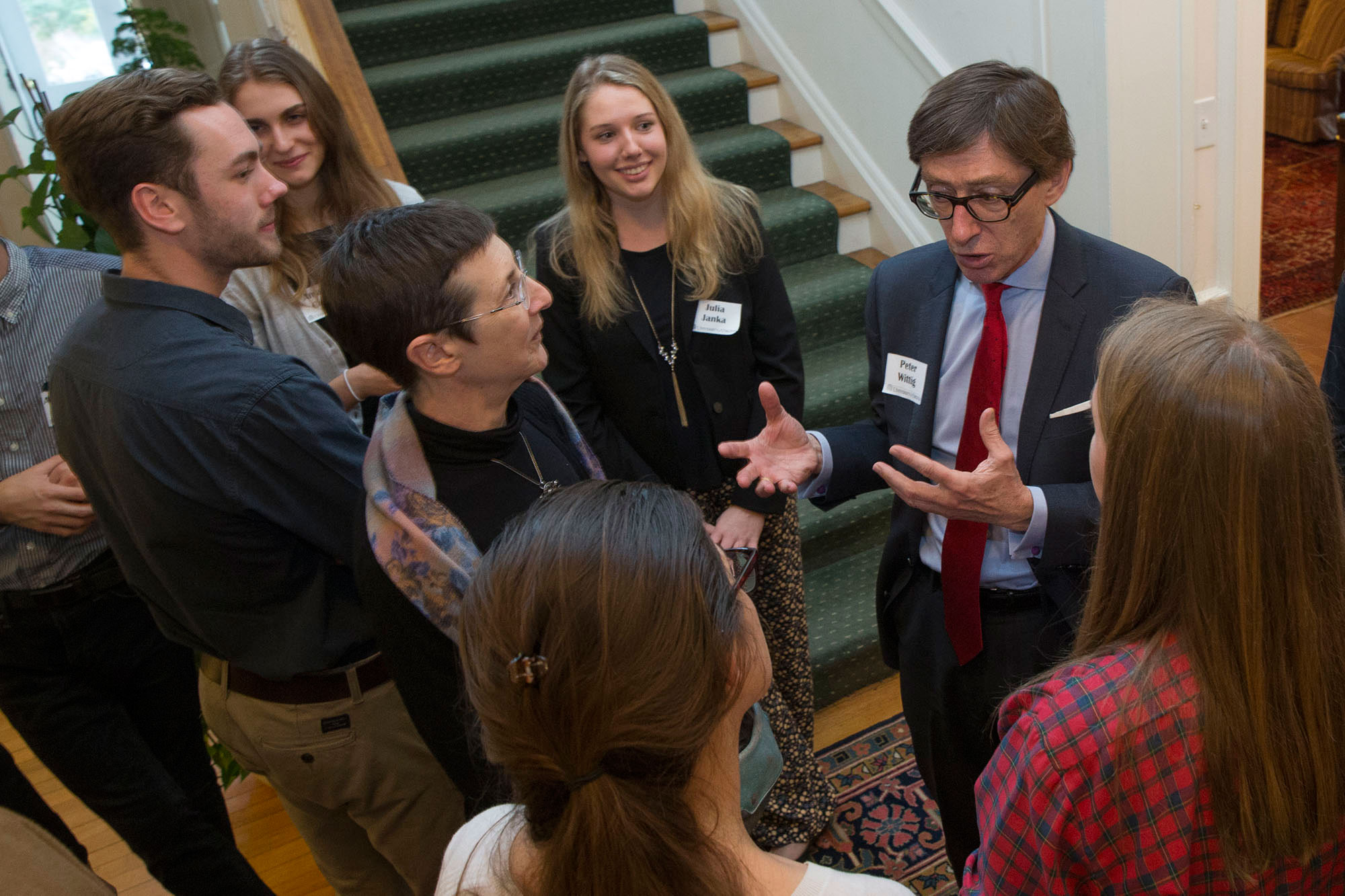 German Ambassador to the U.S. Peter Wittig talking with students in a hallway