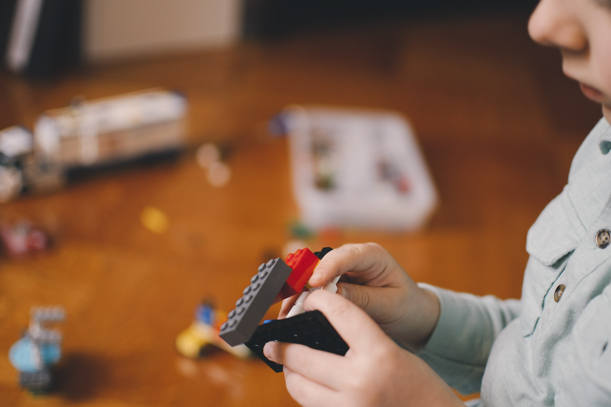 Child building with legos