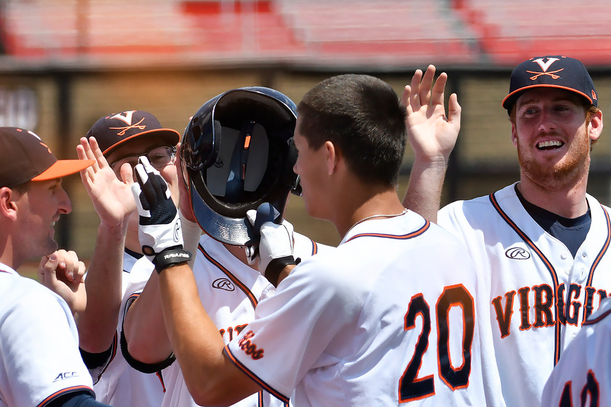 UVA baseball team giving each other high fives