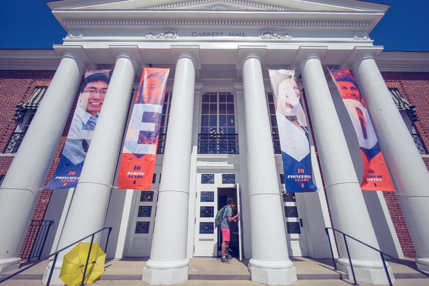 Banners between white columns that spell LEAD