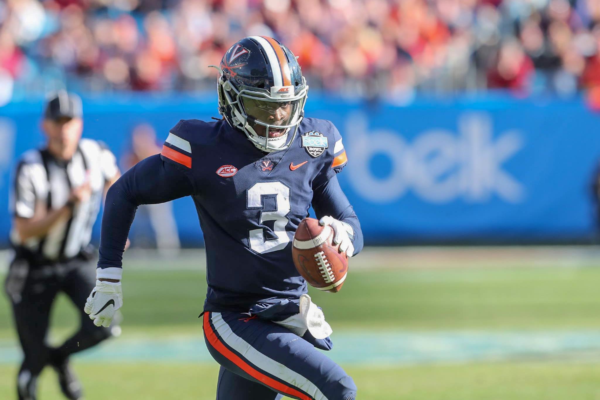 Bryce Perkins runs with the ball during the Belk bowl game