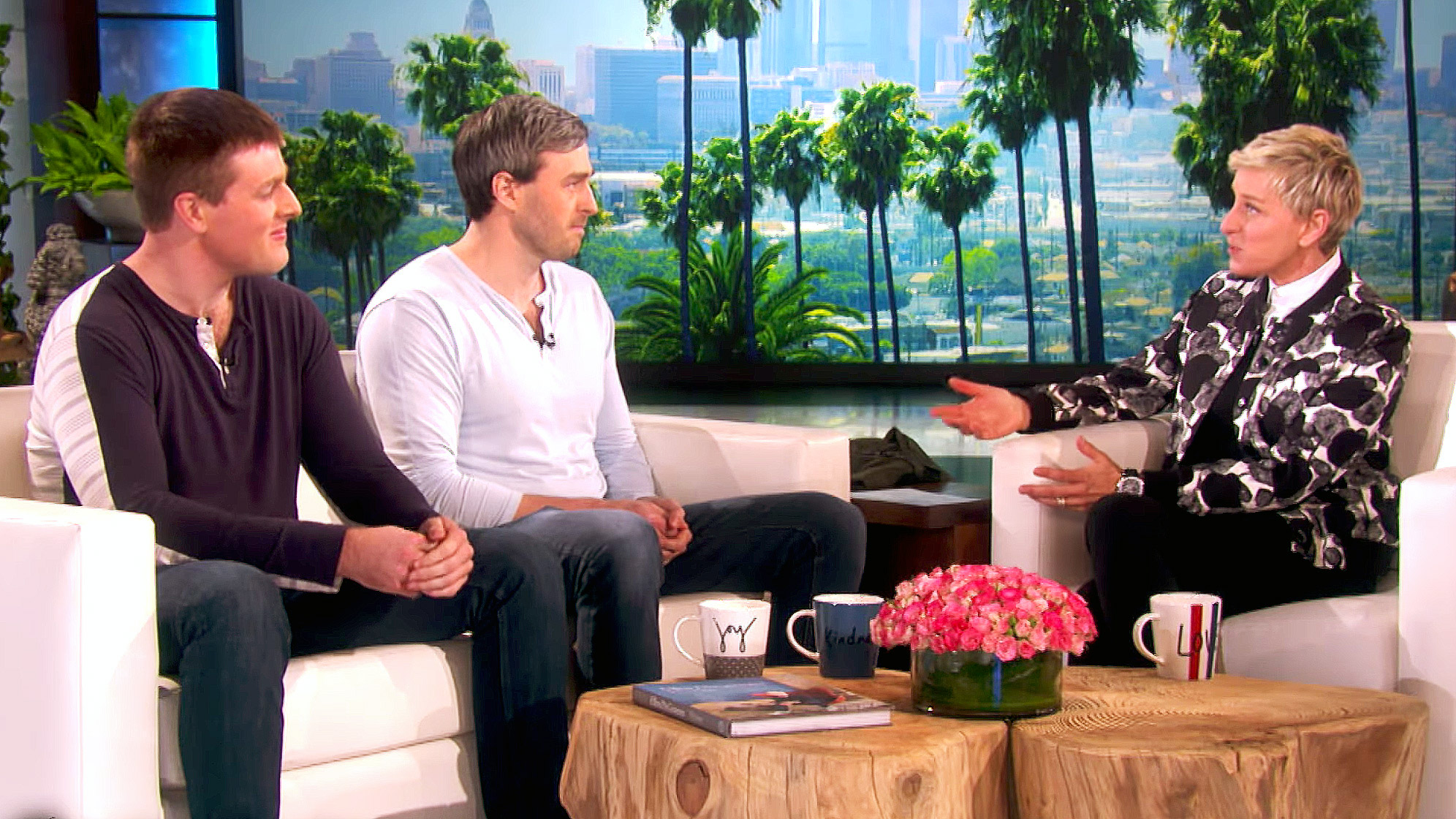 blind brothers sitting on white couches talking to Ellen DeGenerous on her talk show
