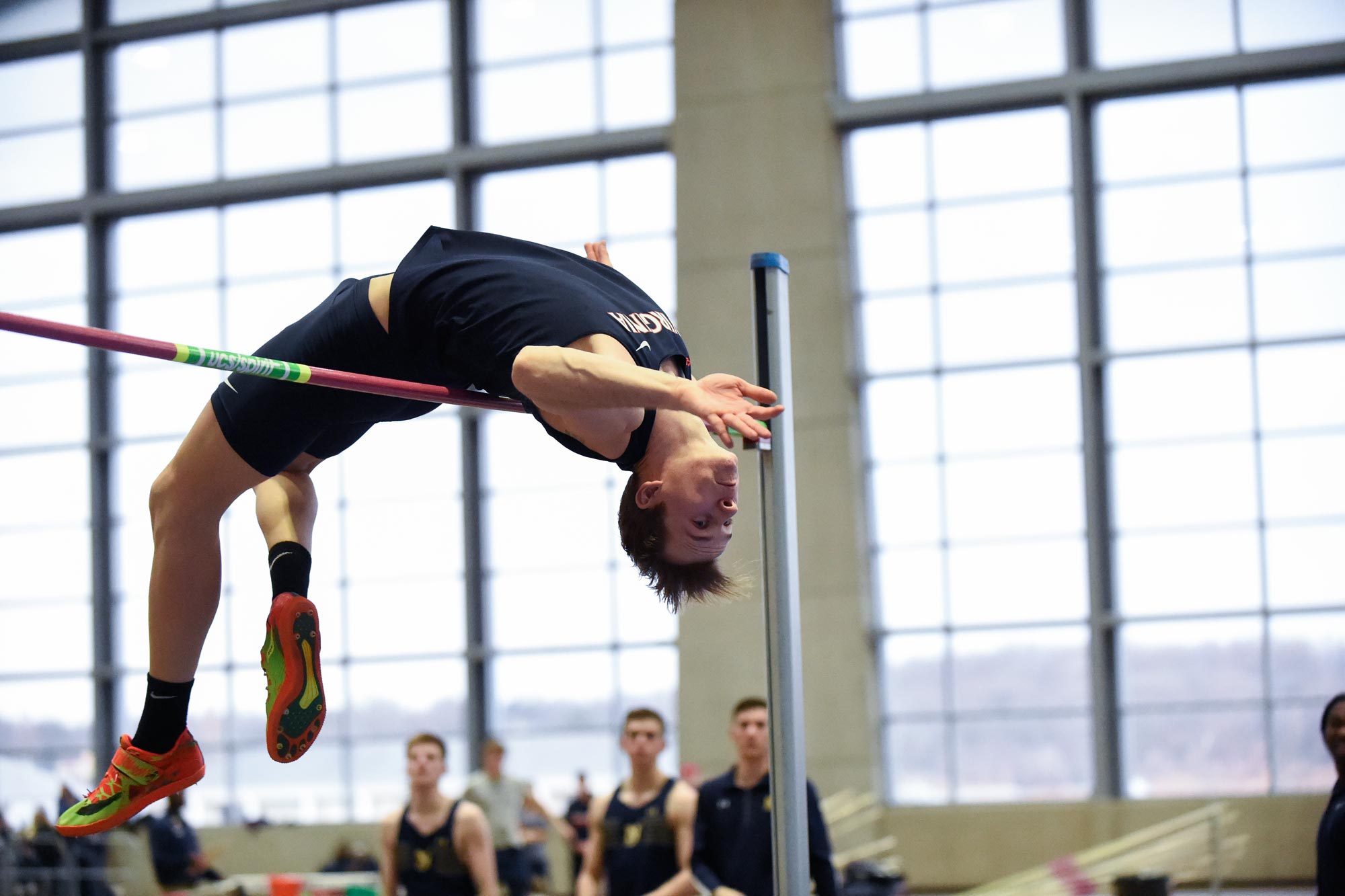 Brenton Foster bending backwards as he jumps over a pole during high jump