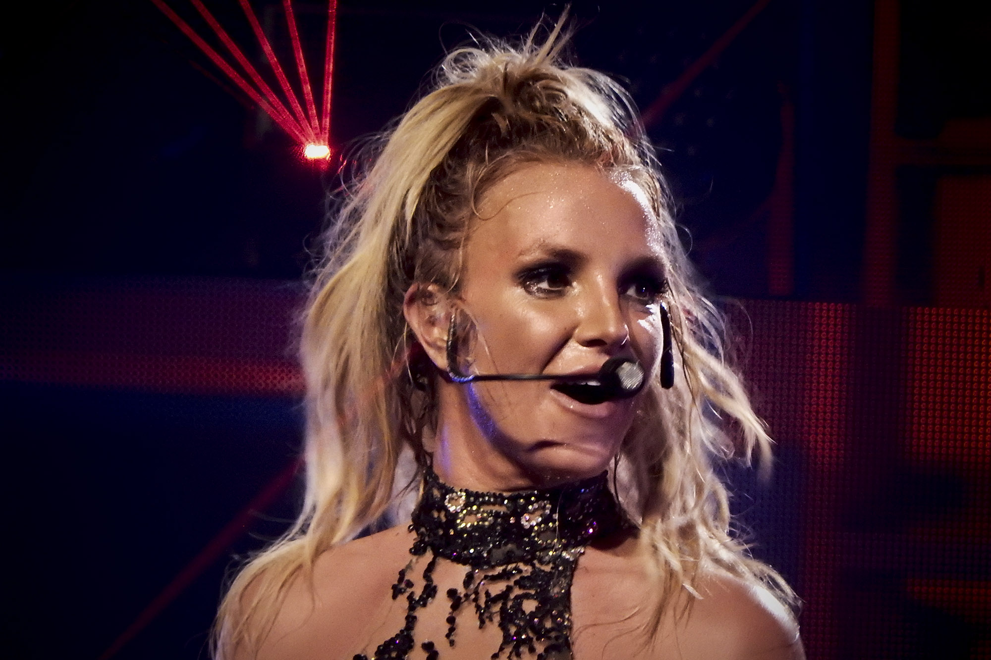 Brittany Spears headshot of her on stage with microphone