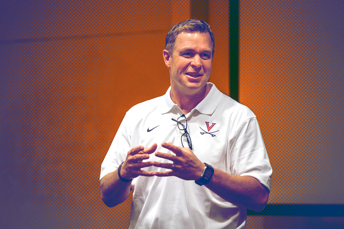 Bronco Mendenhall speaking to a crowd from a stage