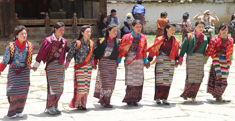 Bhutan dancers dancing in traditional clothing