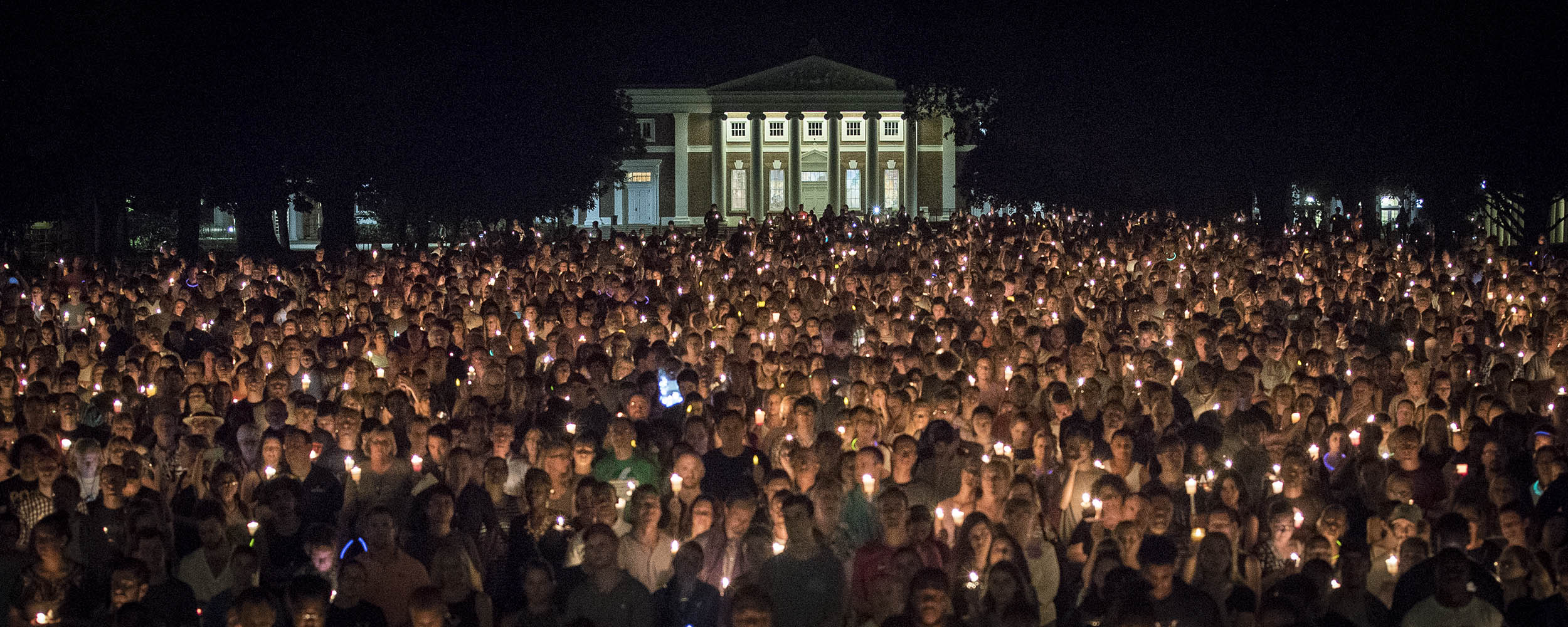Thousands gather on the Lawn holding candles