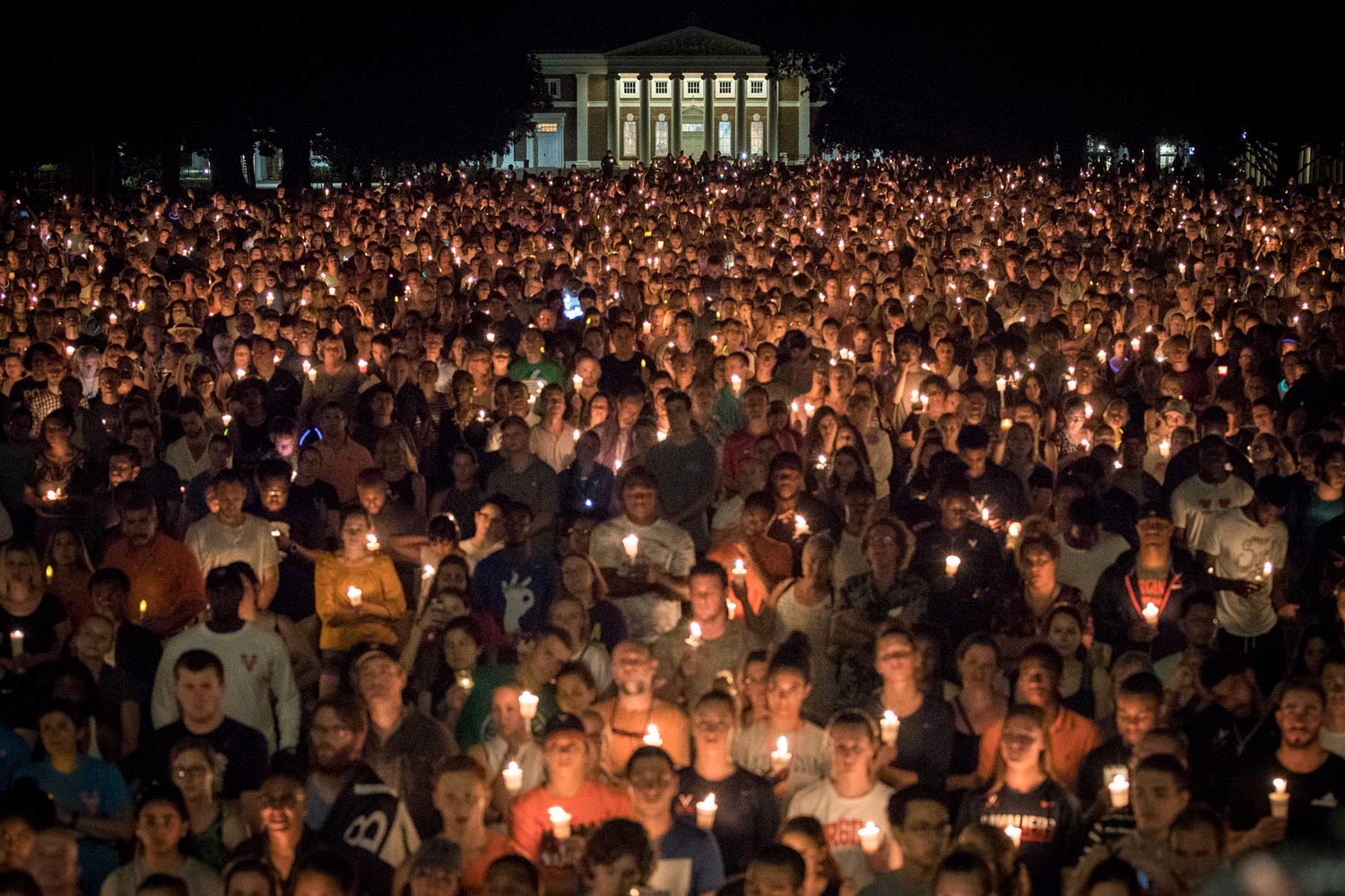 Thousands gather on the Lawn as they hold candles during a vigil
