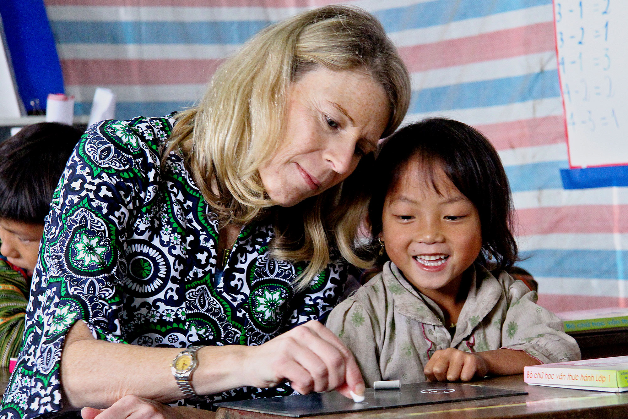 Carolyn Miles working with a child