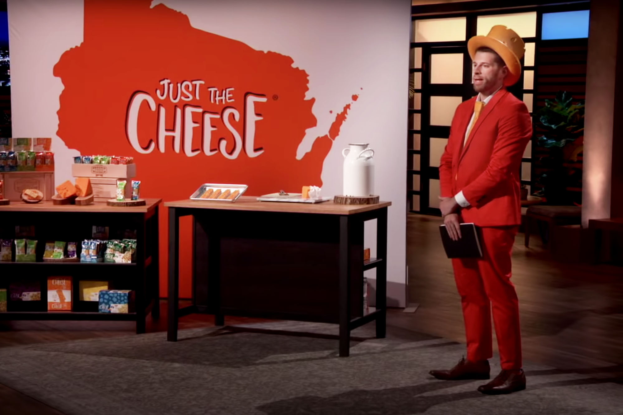 David Scharfman stands on the set of Shark Tank with his company Just the cheese