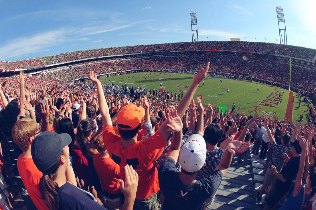 UVA fans cheering from the stands for the Football team