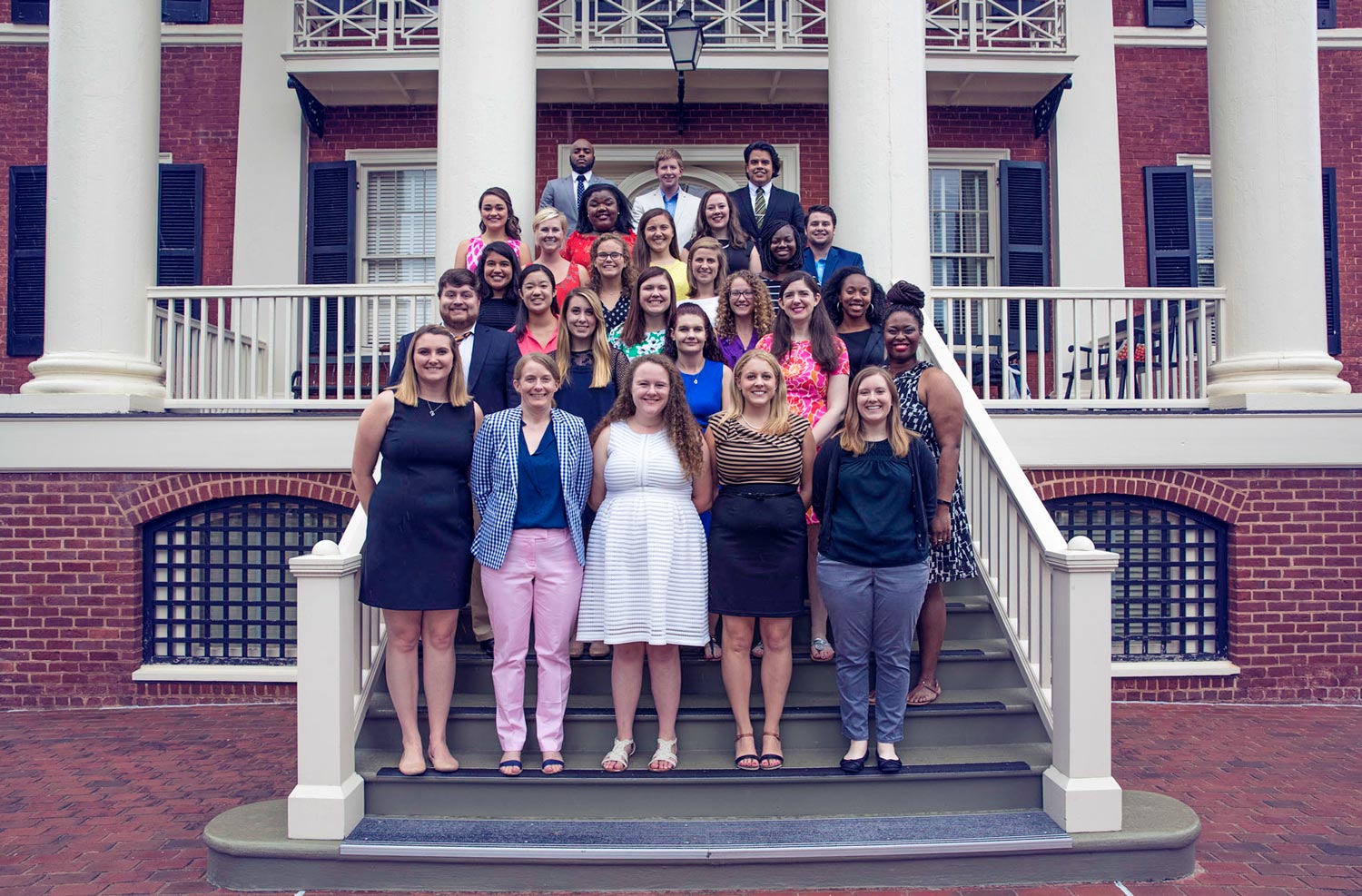  Virginia College Advising Corps stand on the steps of a building for a group picture