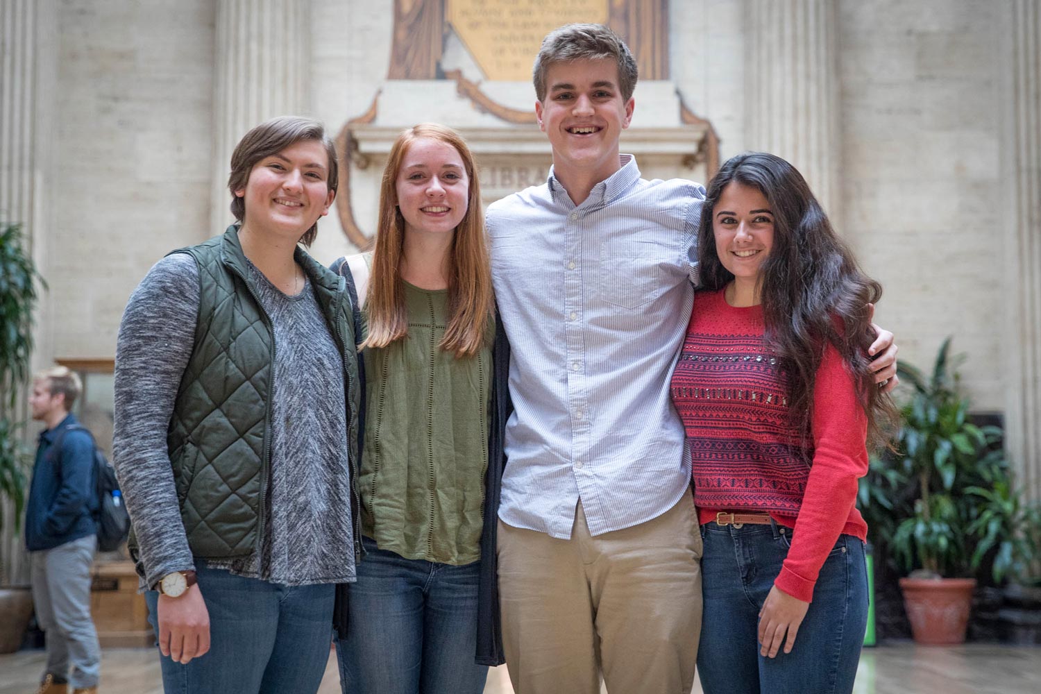 From left to right: Mary Grace Sheers, Jenna Wichterman, Jack Wilkins and Alexandra Dimas  stand together smiling at the camera