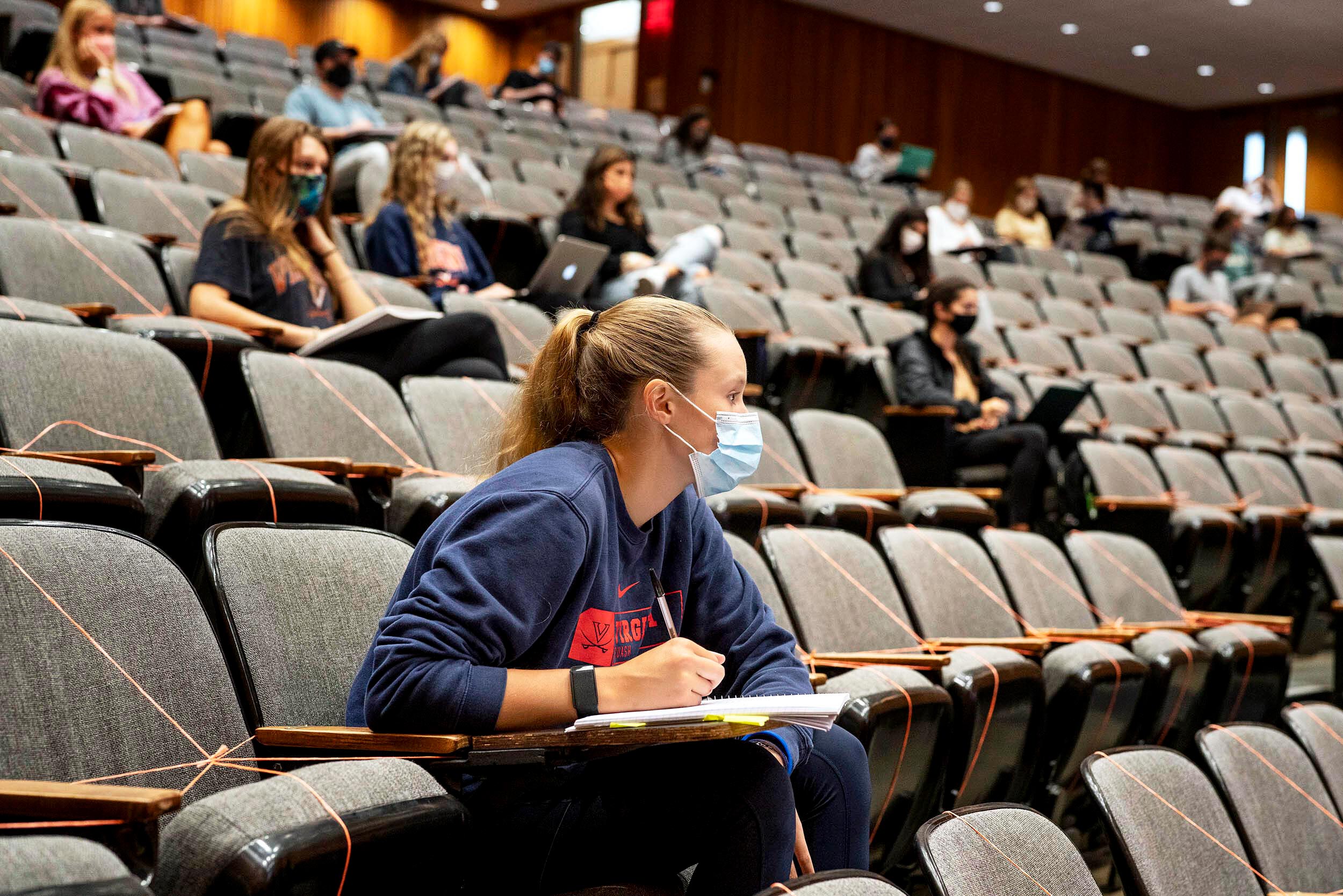 Students socially distanced in a lecture hall