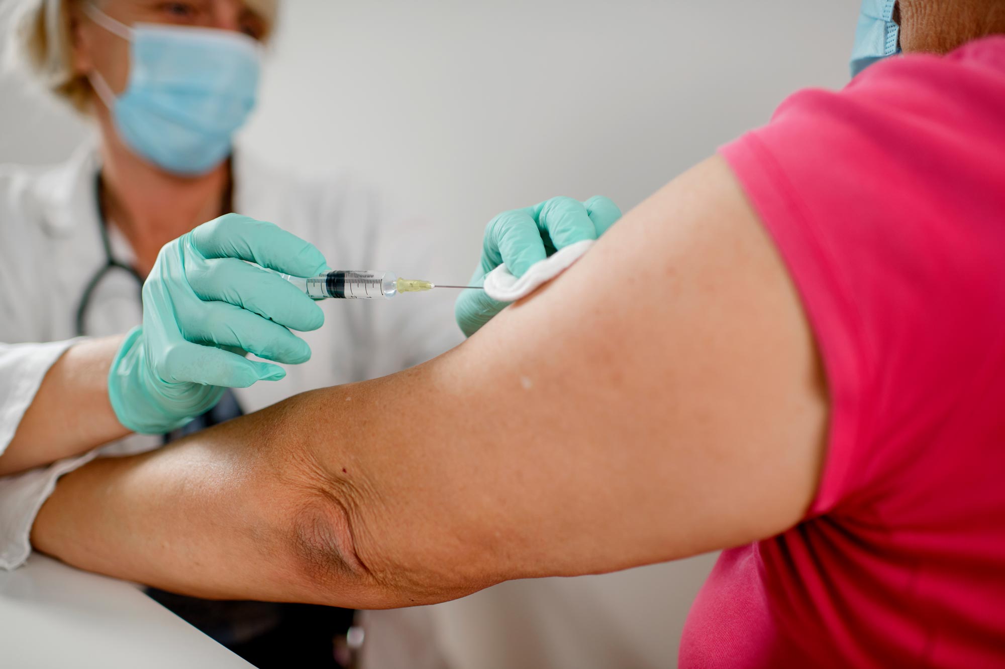 Healthcare provider giving an injection to a patient