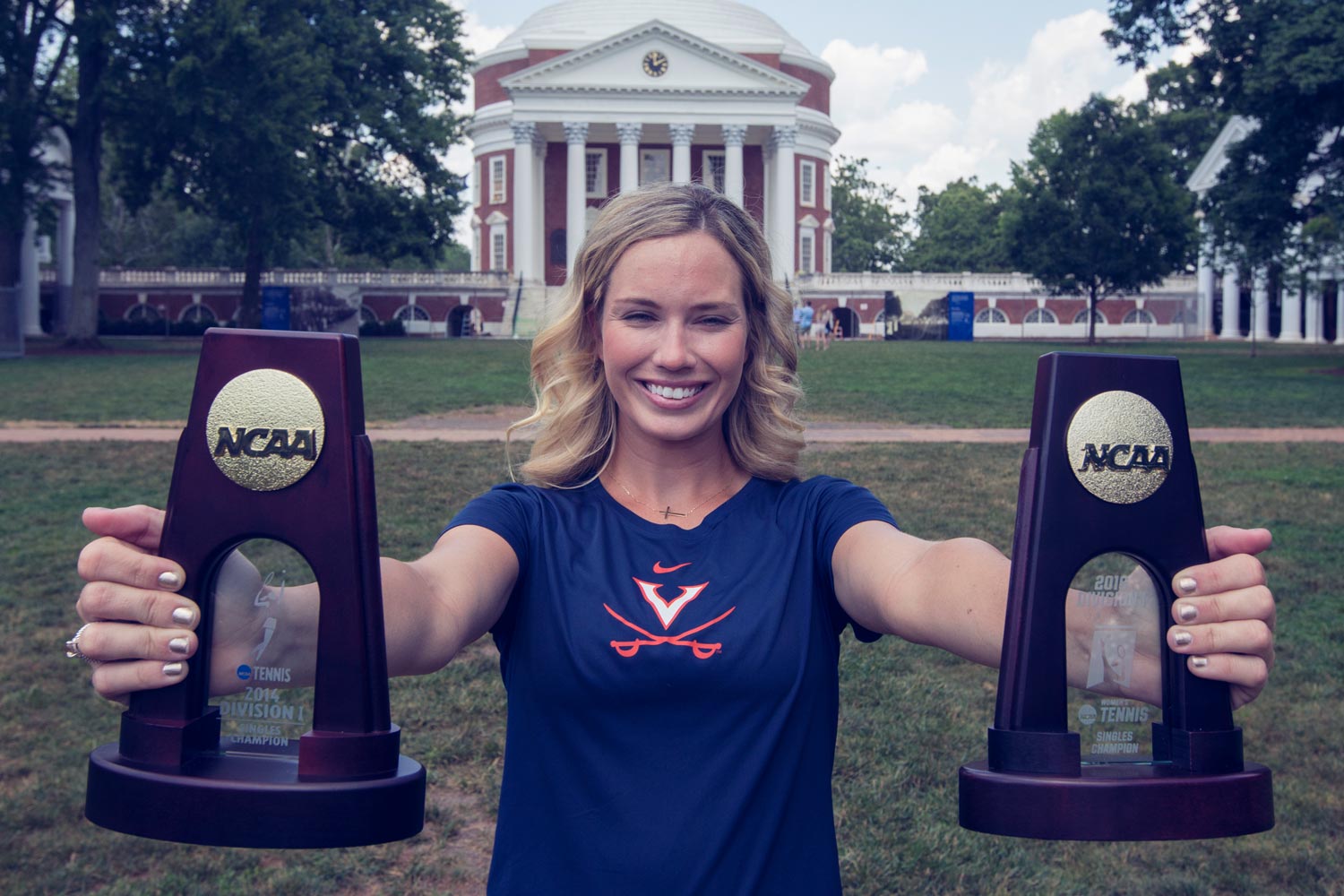 Danielle Collins holds her two Tennis NCAA awards in front of the Rotunda