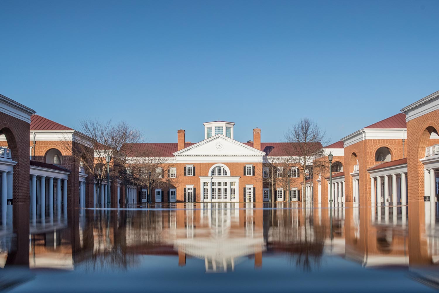The Darden School of Business reflection fountain between the brick buildings