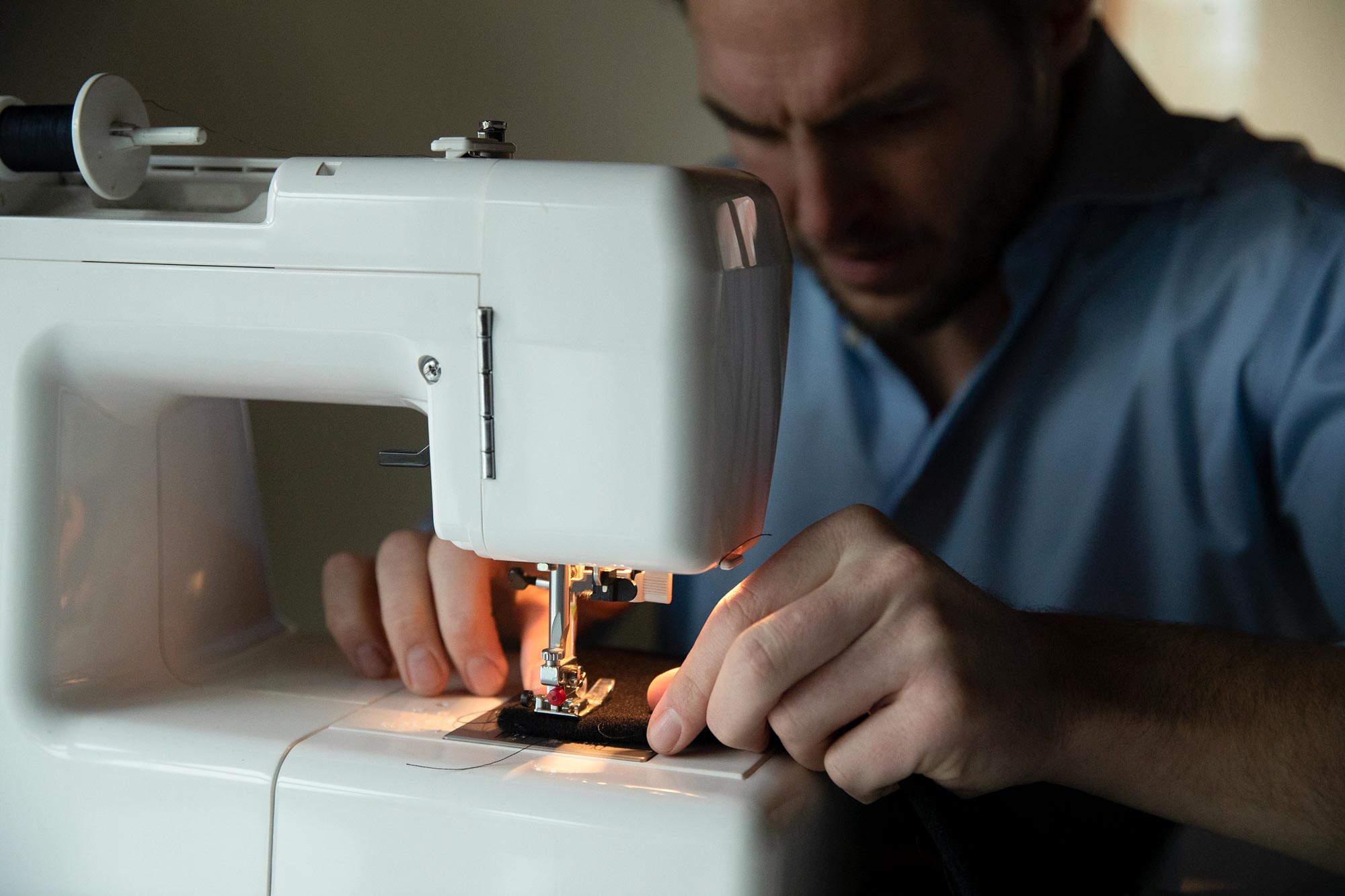 person using a sewing machine