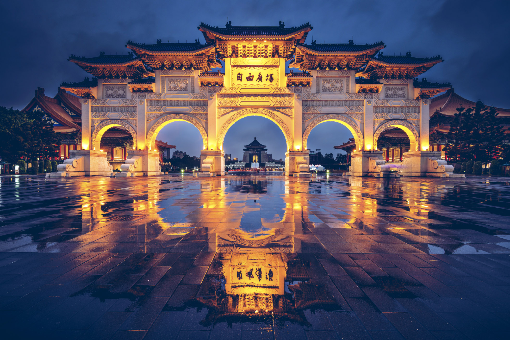 Taiwan arches reflecting off of rain puddles on its patio