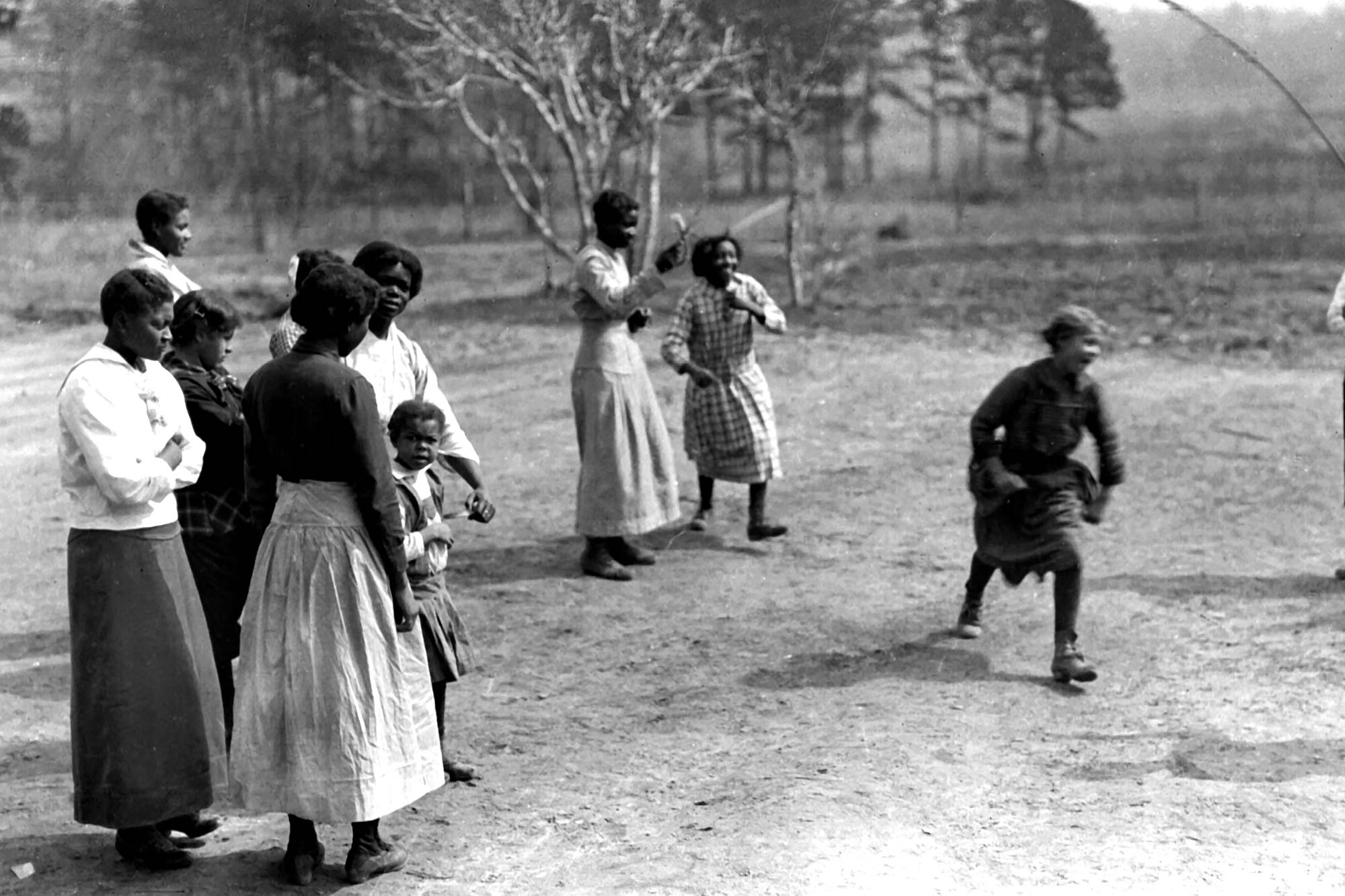 black and white image of African Americans jumping rope during recess