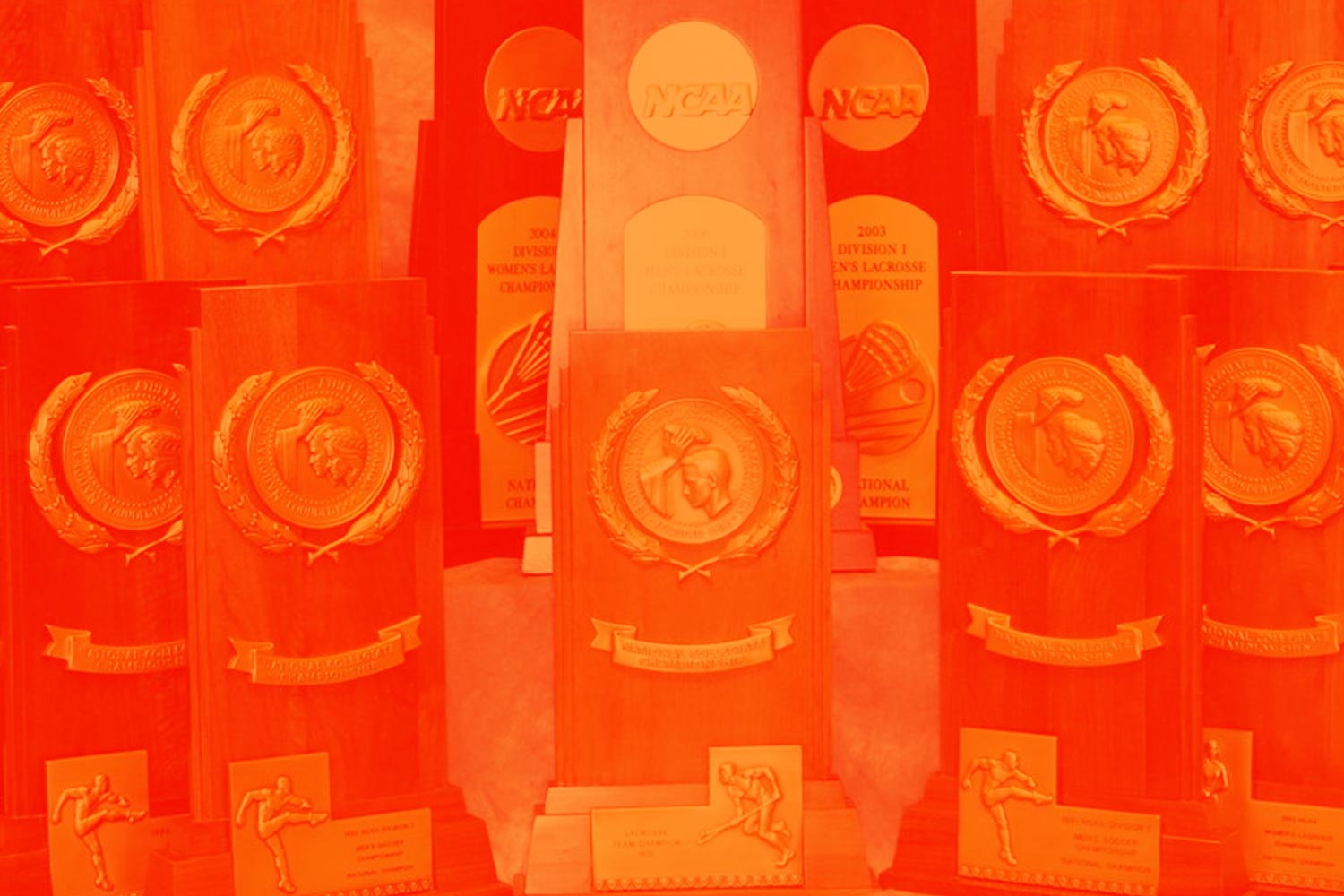 NCAA trophies graphic with an orange overlay