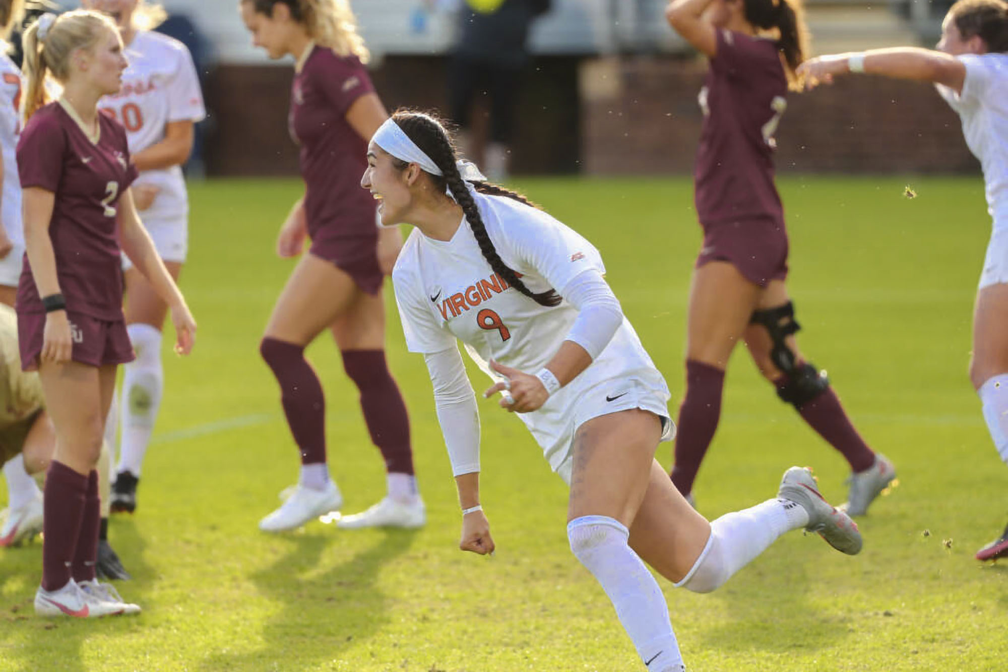 Diana Ordonez running across the Soccer Field after a game against Virginia Tech